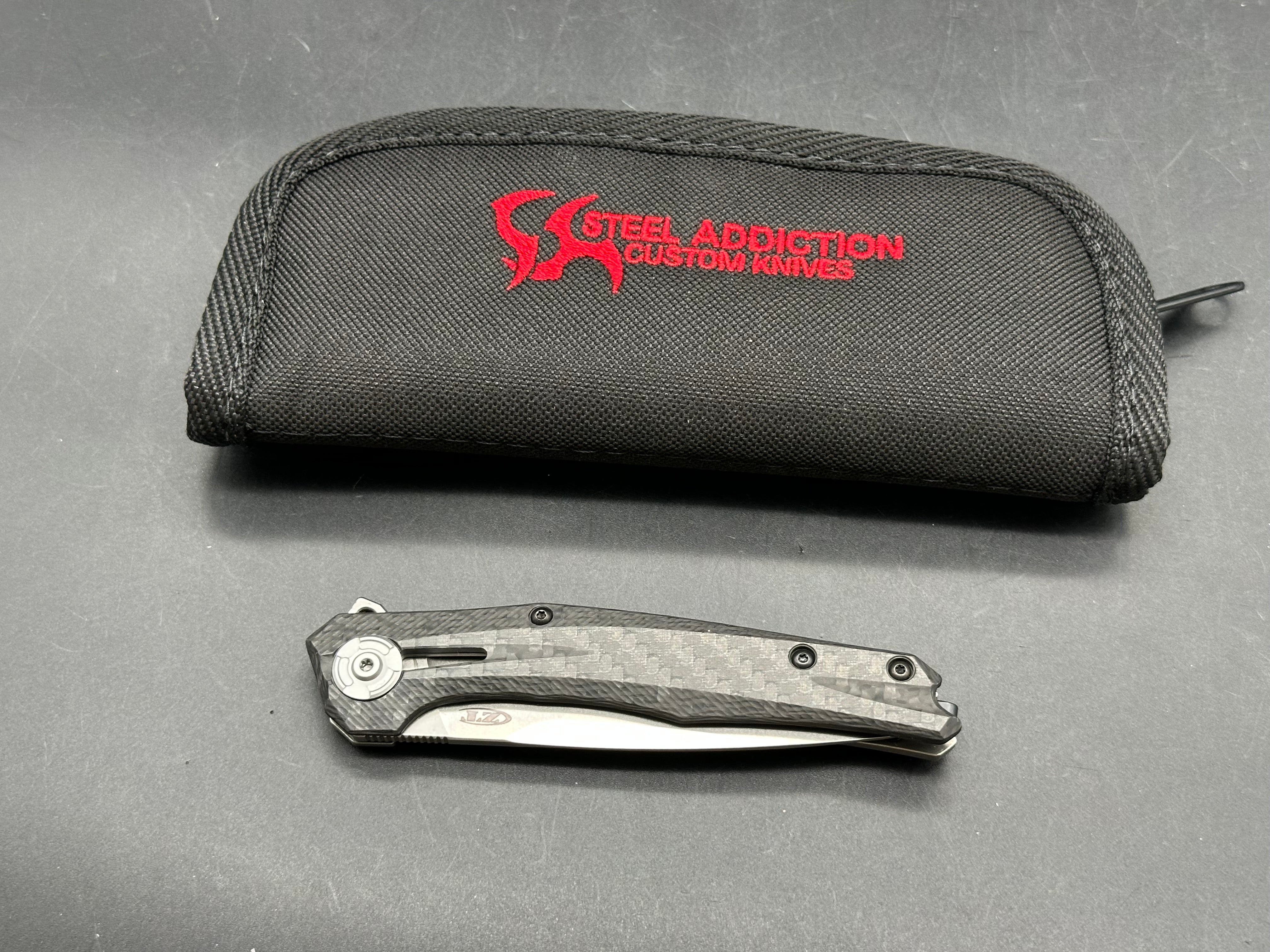 Zero Tolerance ZT 0707: 3.625 inch tumbled, drop point CPM-20CV blade. Titanium handle