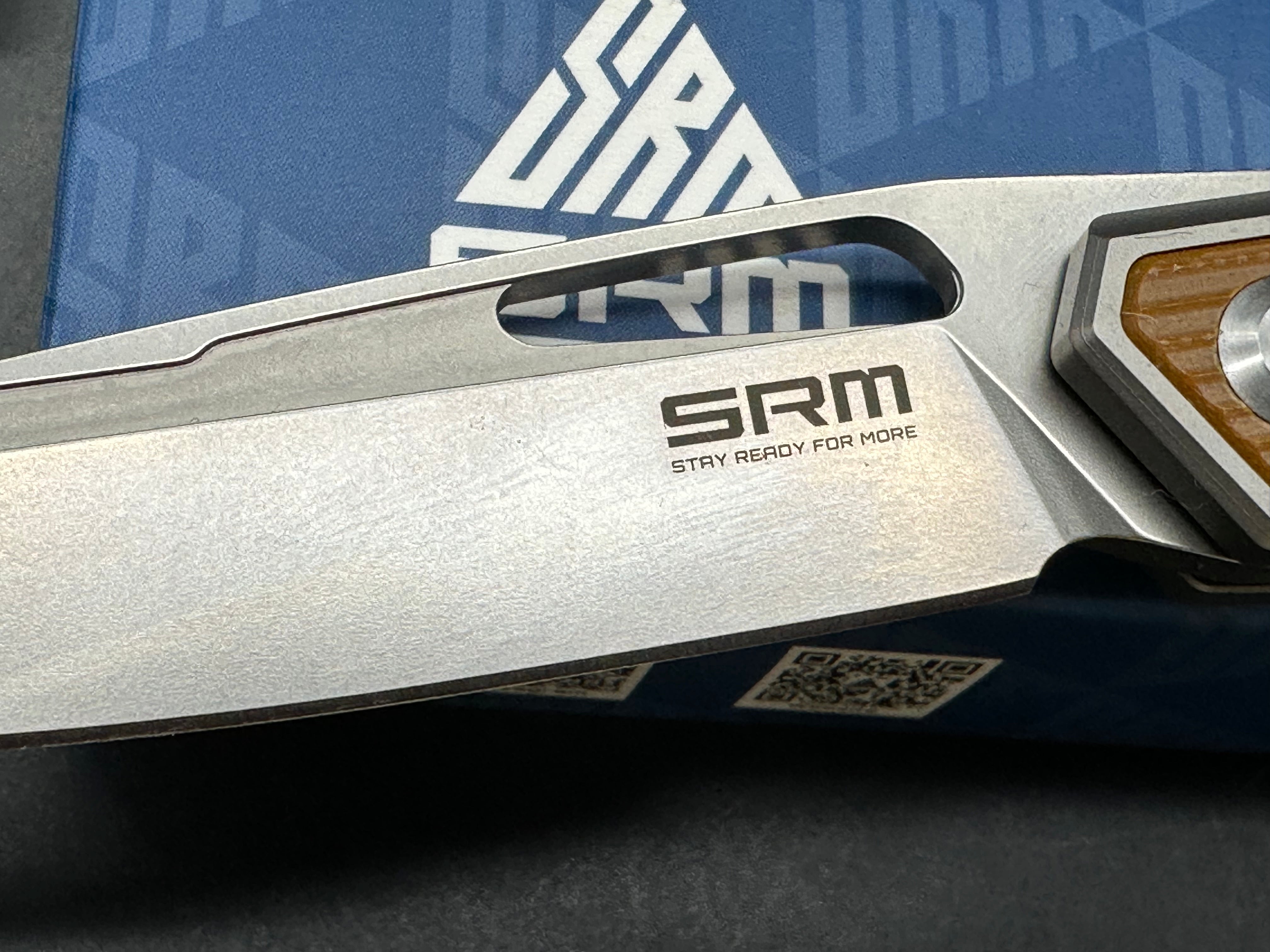 SRM model 1421: 3.63 inch N690 blade. Titanium frame with tan G10 insert