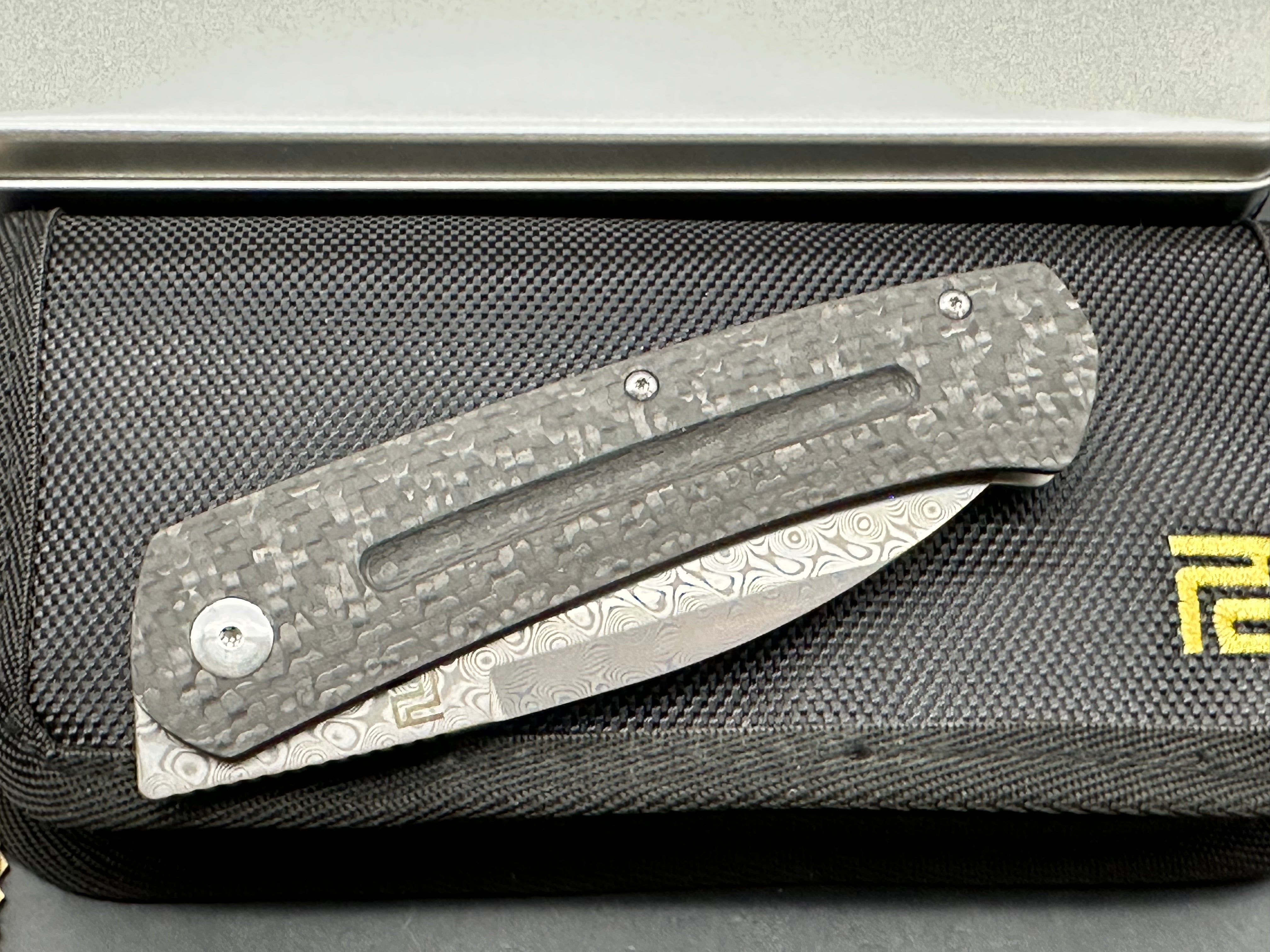Artisan Cutlery Centauri: 3.5 inch Damascus blade. Front flipper. Carbon fiber front scale