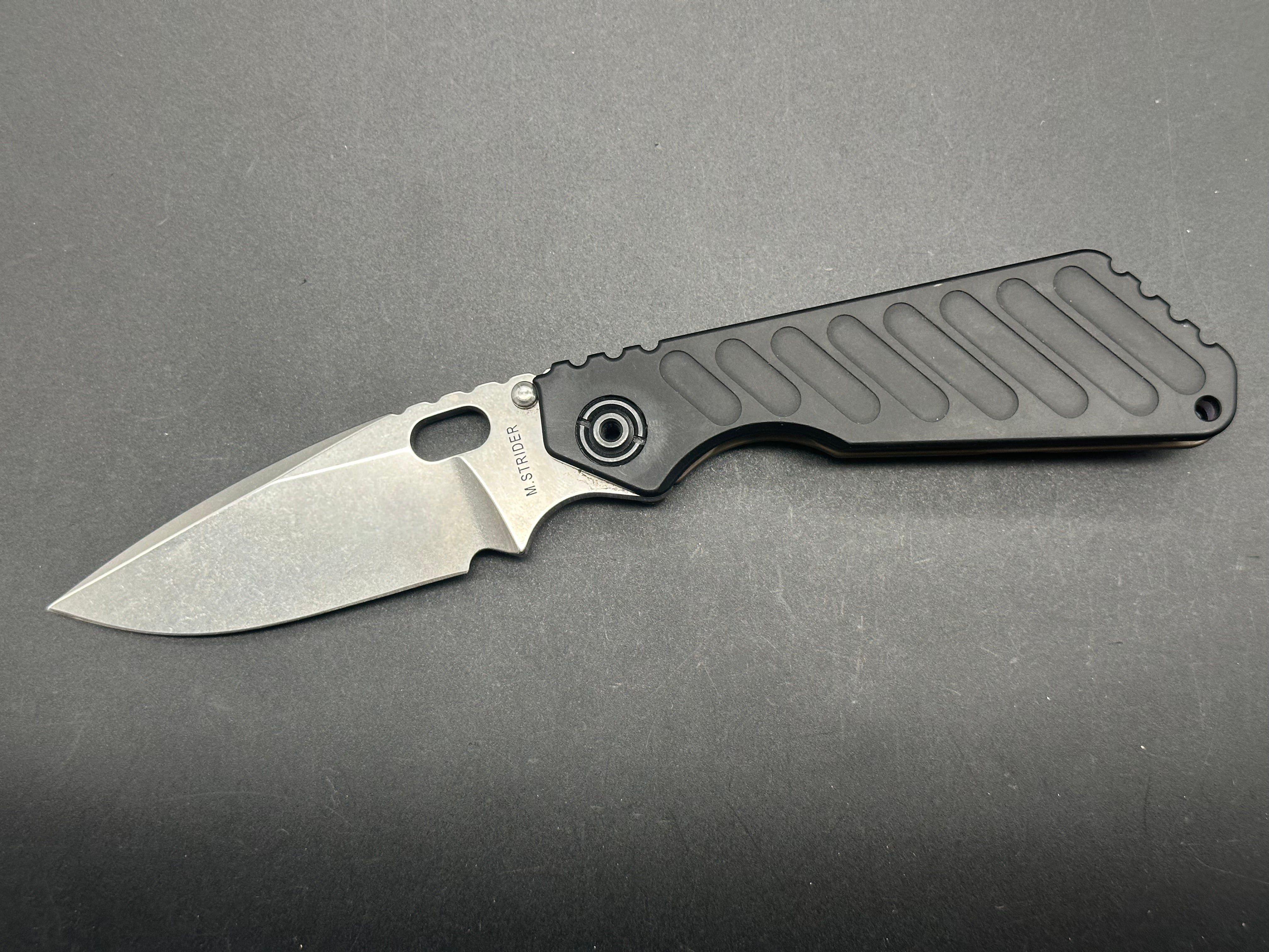Strider SNG With Strider Logo, Black Aluminum And Flamed Titanium CPM20CV
