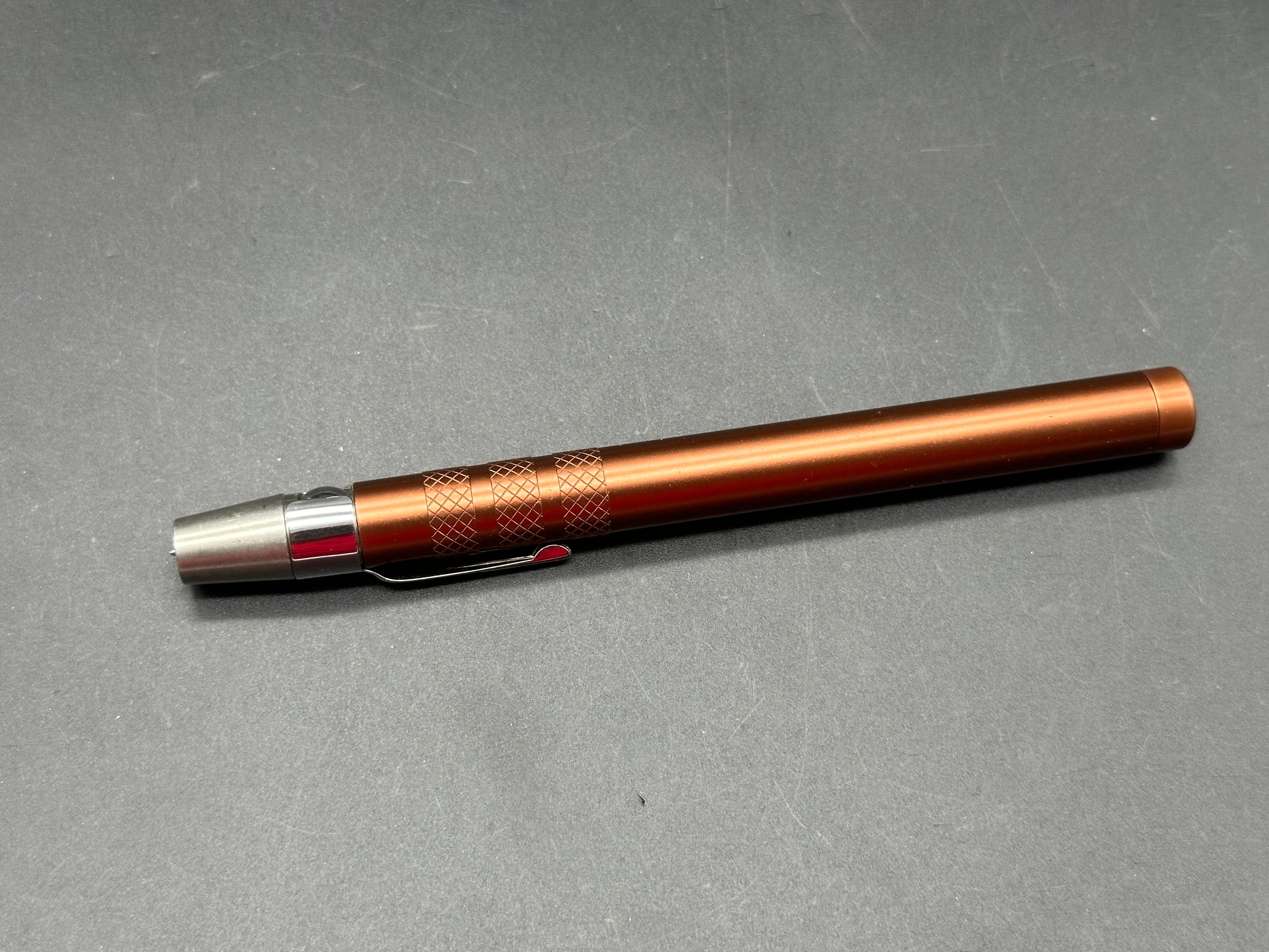 Spring loaded glass breaker / ice pick