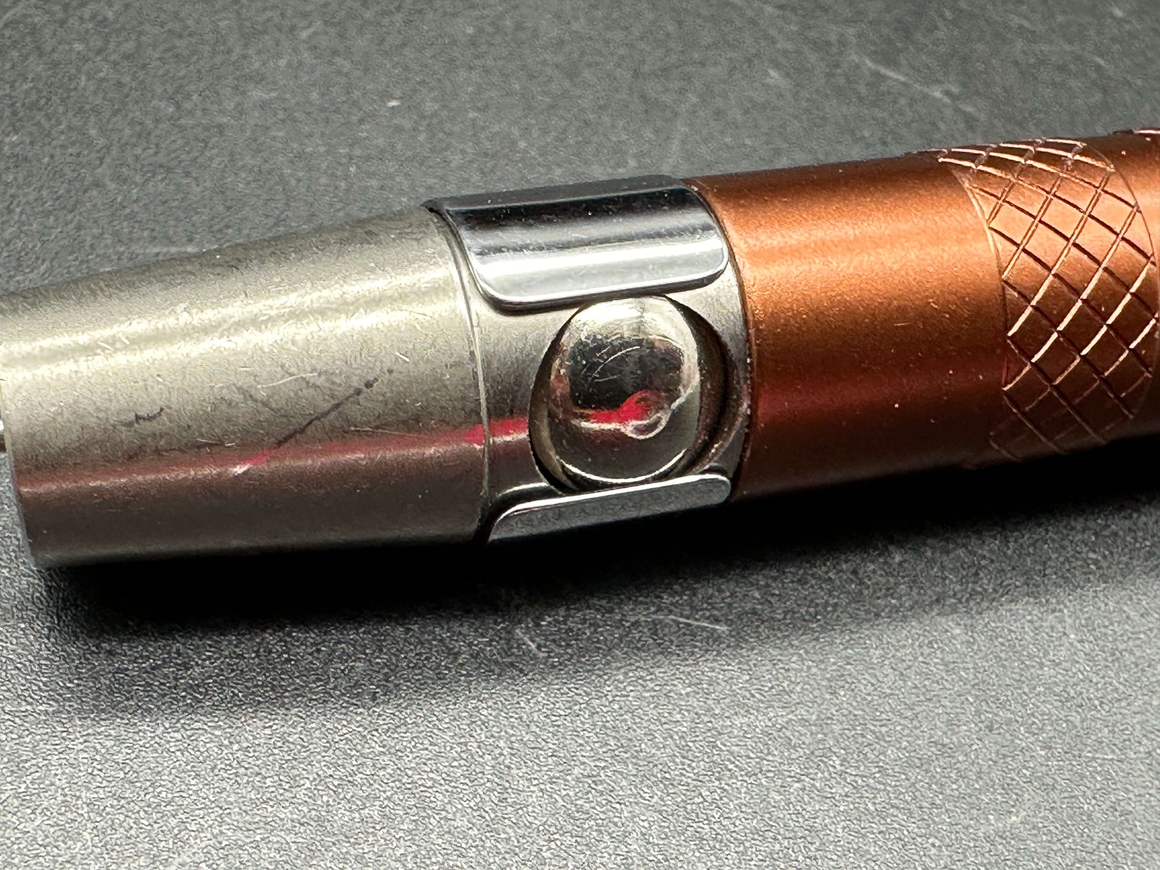 Spring loaded glass breaker / ice pick