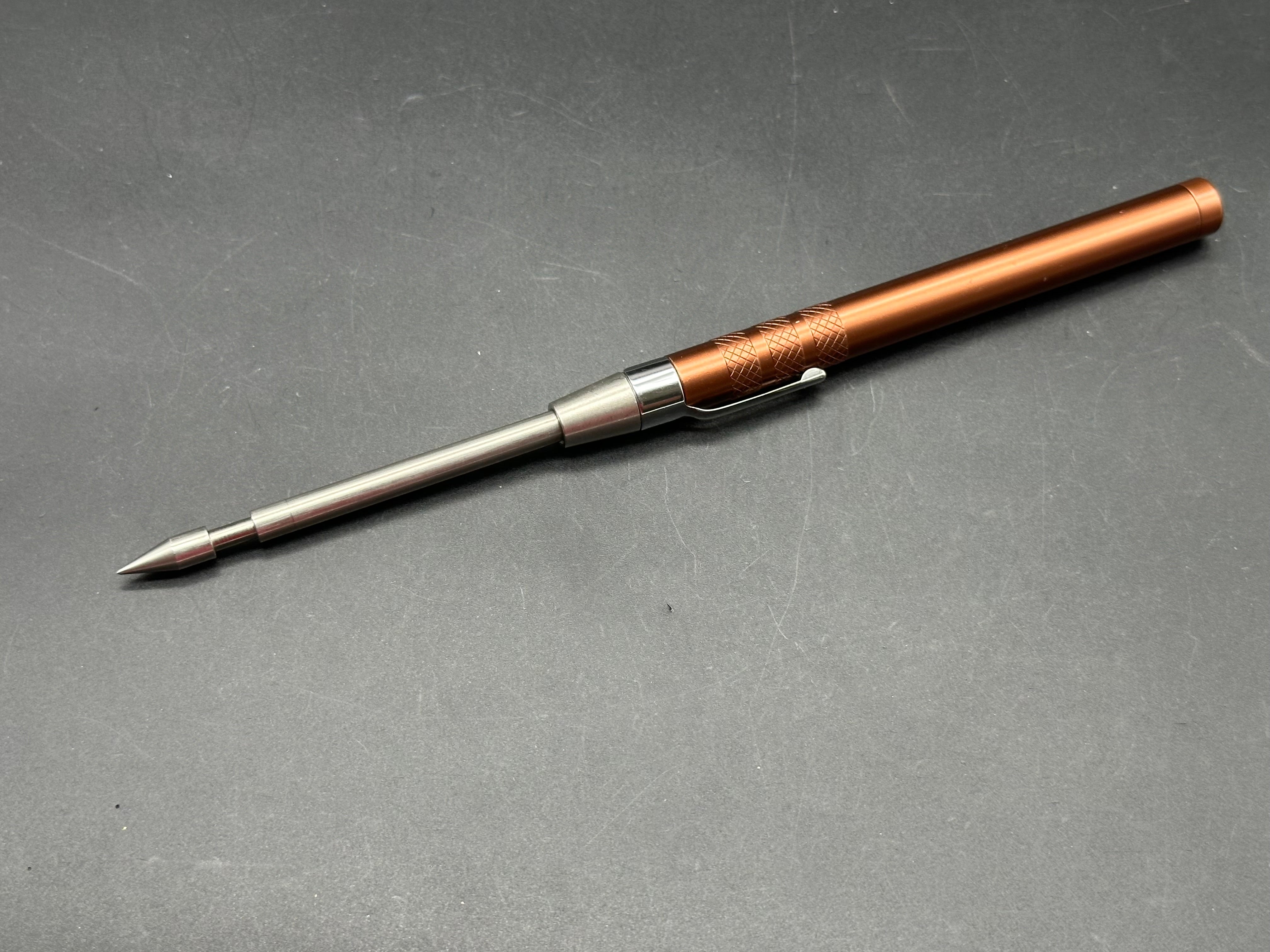 Spring loaded glass breaker / ice pick