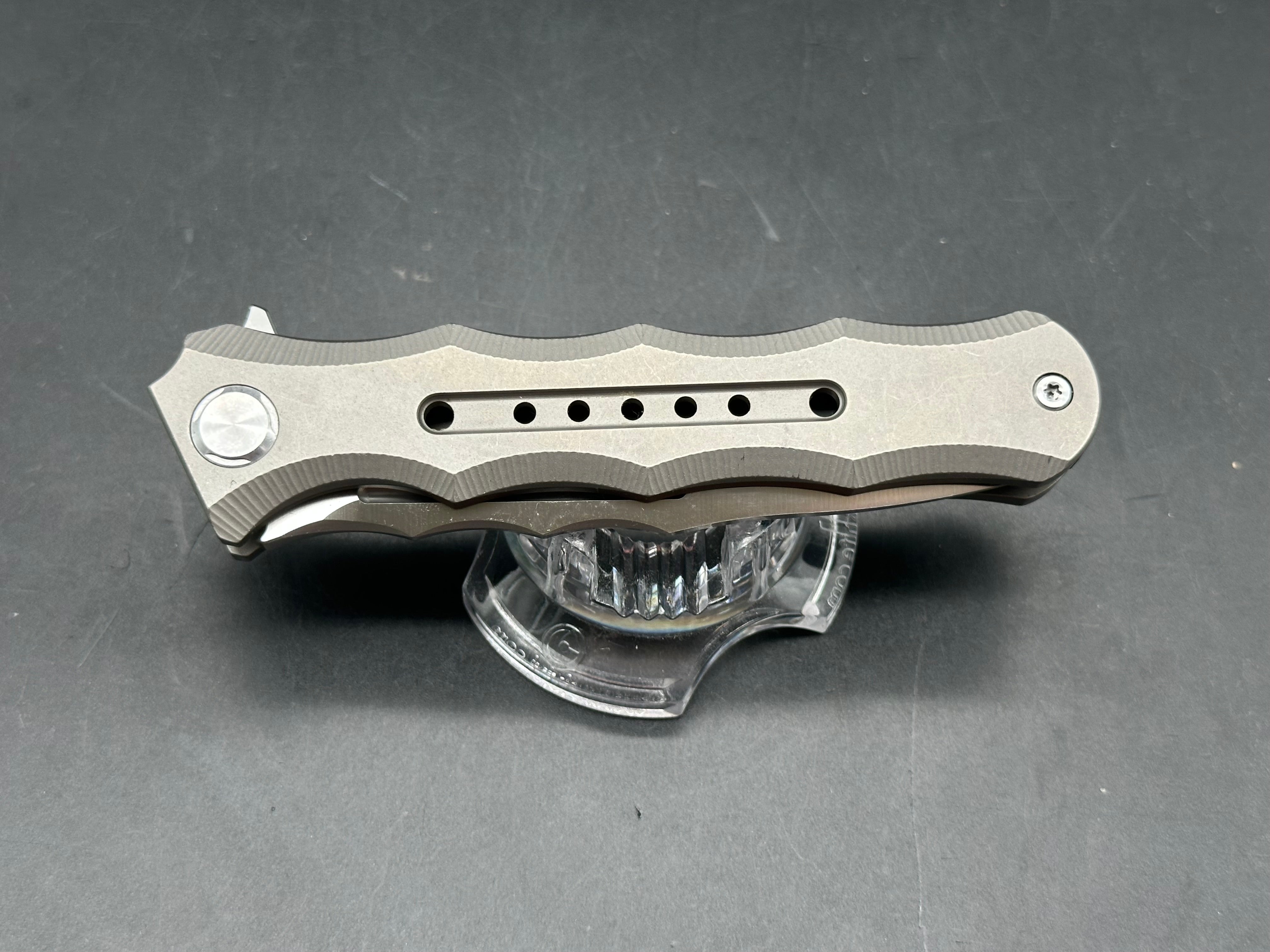 TwoSun TS165 Wong design. 3.5 inch satin finish, flat grind Bohler M390 blade. Titanium frame
