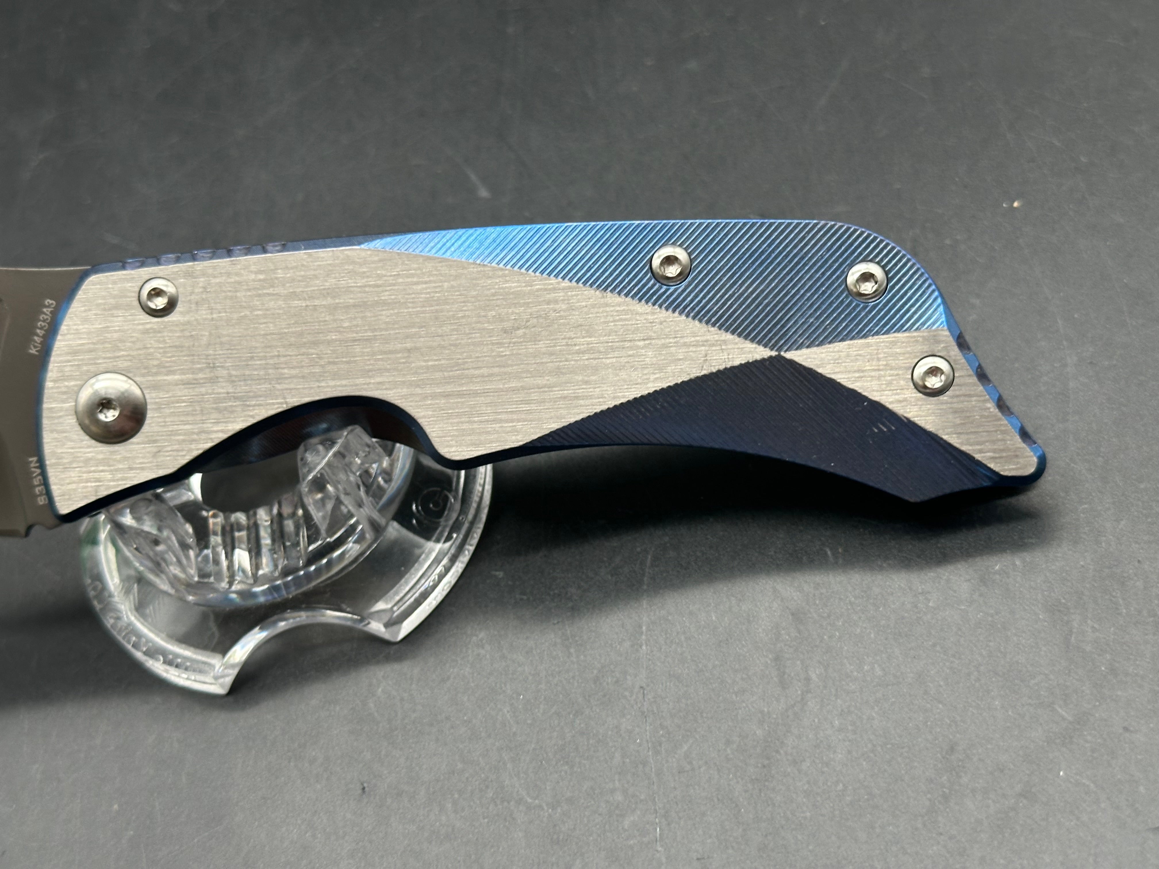Kizer LGM: 4 inch titanium coated CPM-S35VN blade. Two tone anodized titanium frame