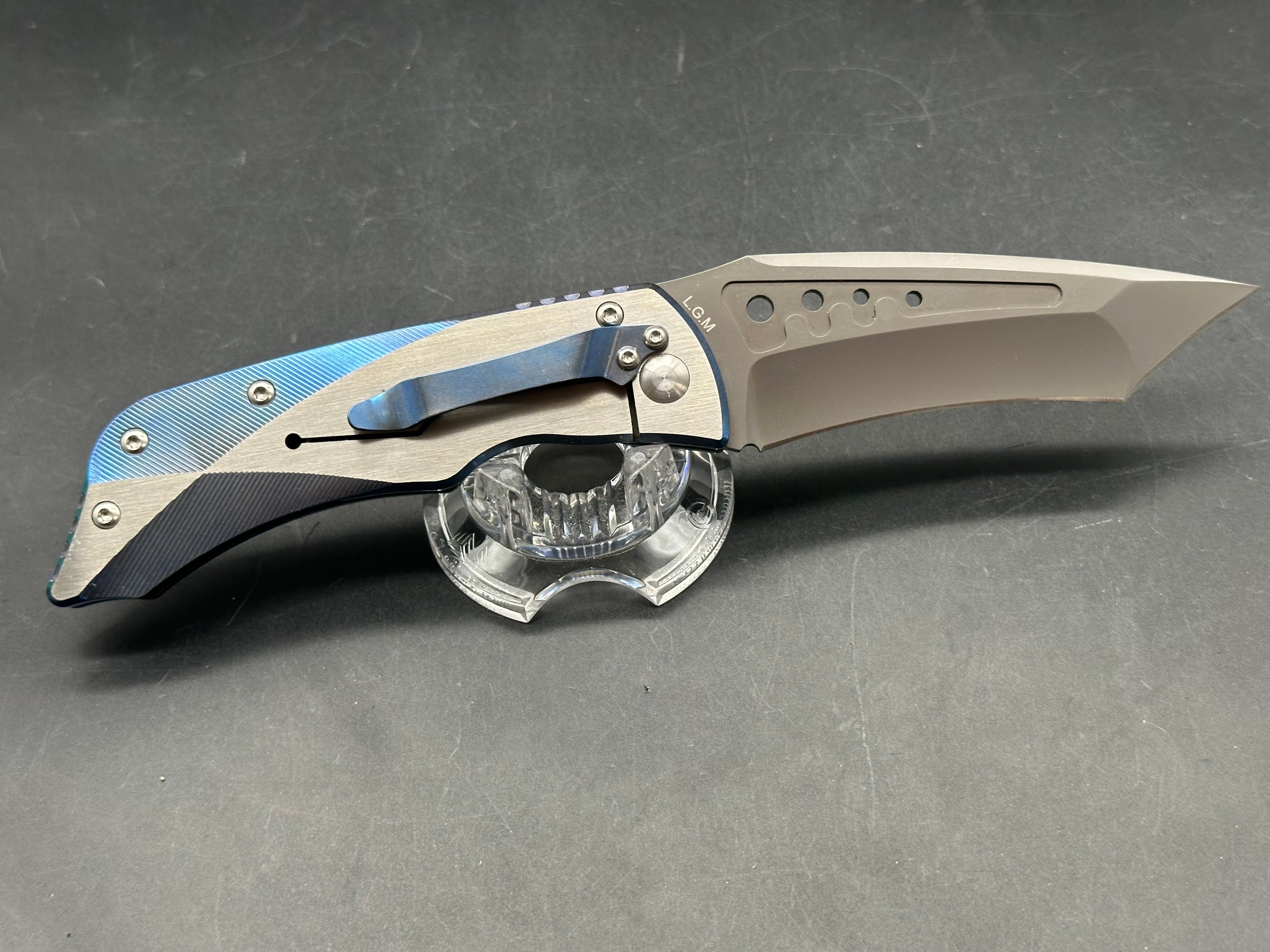 Kizer LGM: 4 inch titanium coated CPM-S35VN blade. Two tone anodized titanium frame