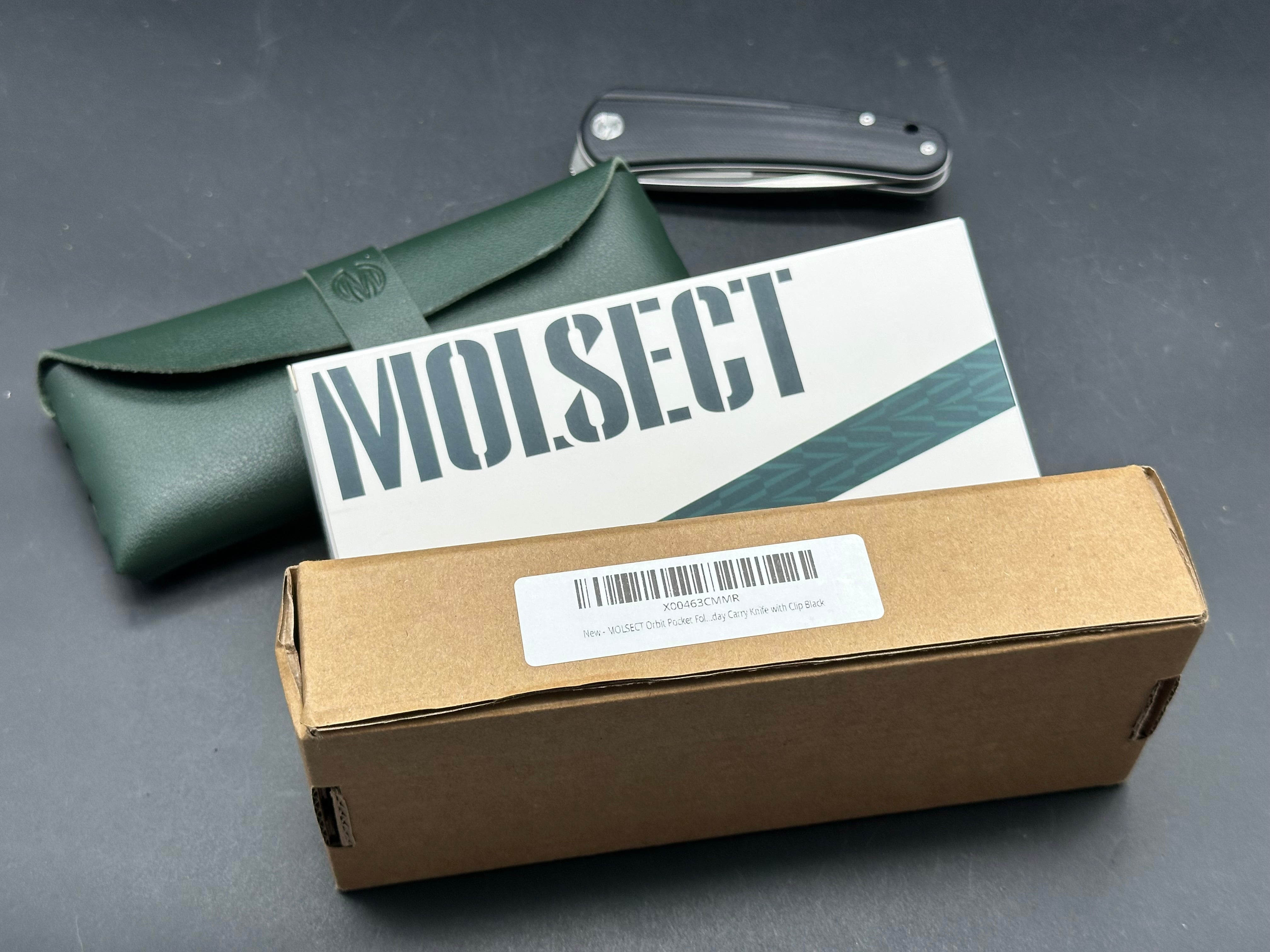 Molsect Orbit liner lock black G10 scales hollow grind 14C28N blade