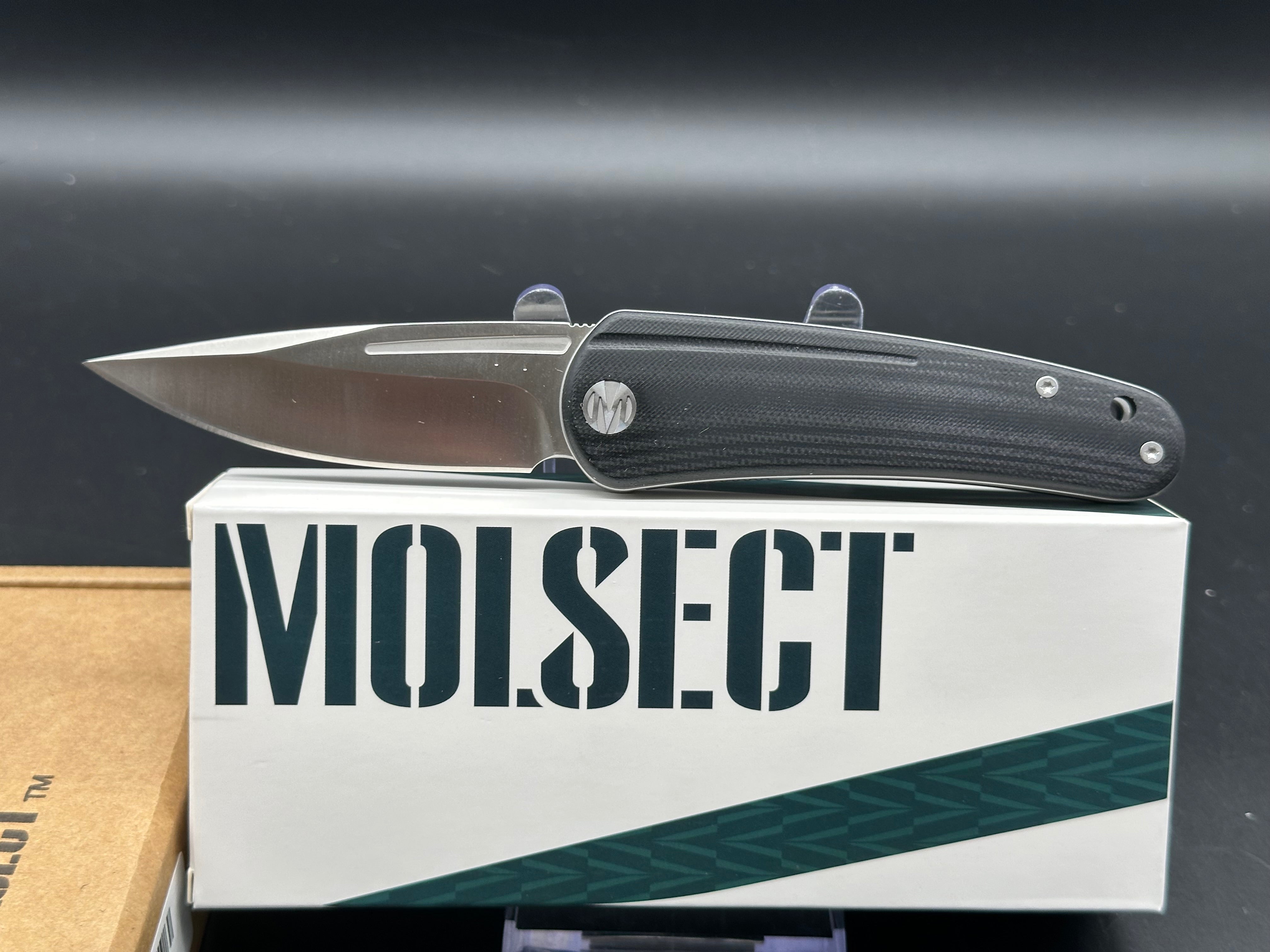 Molsect Orbit liner lock black G10 scales hollow grind 14C28N blade