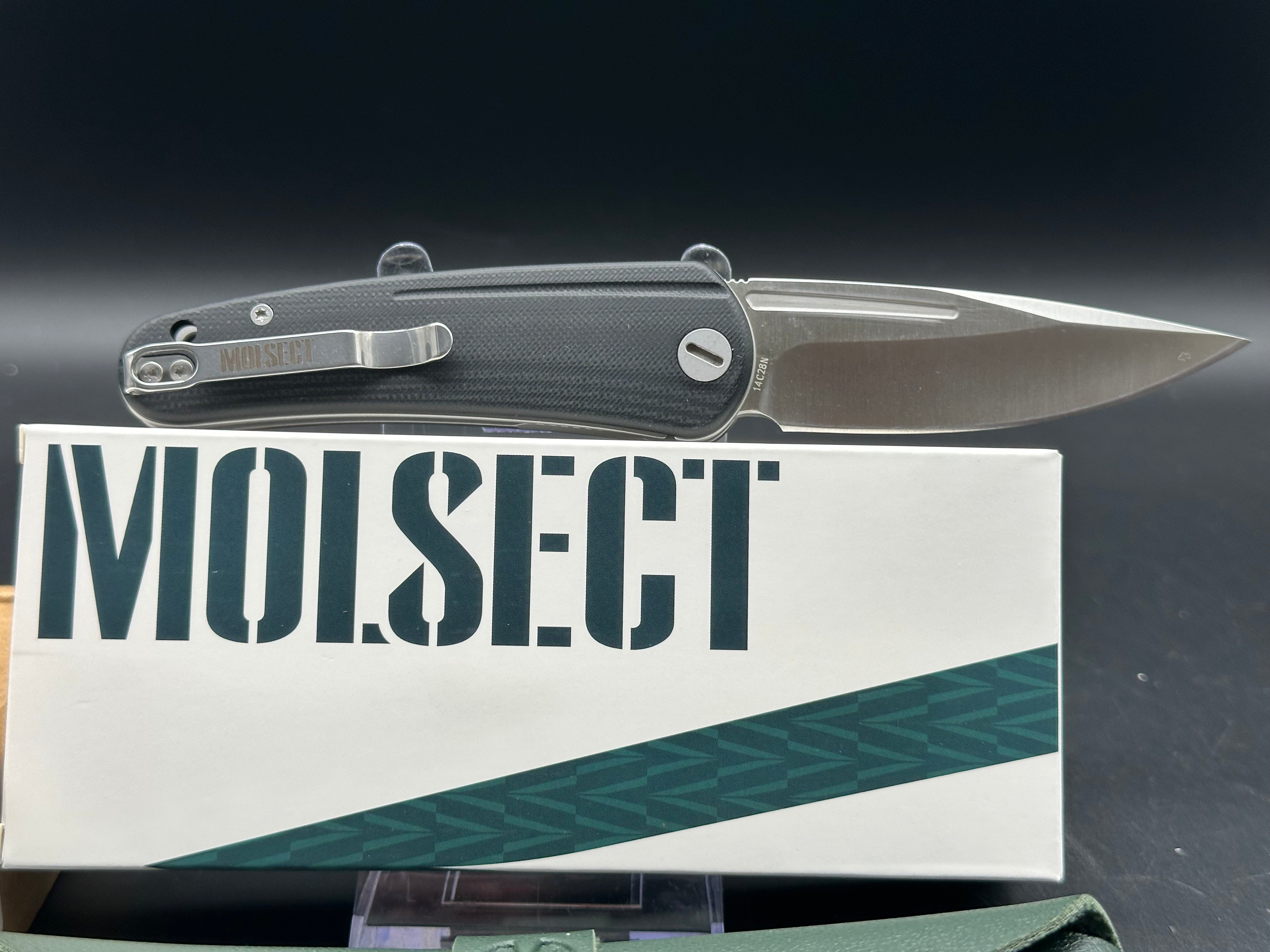Molsect Orbit liner lock black G10 scales hollow grind 14C28N blade
