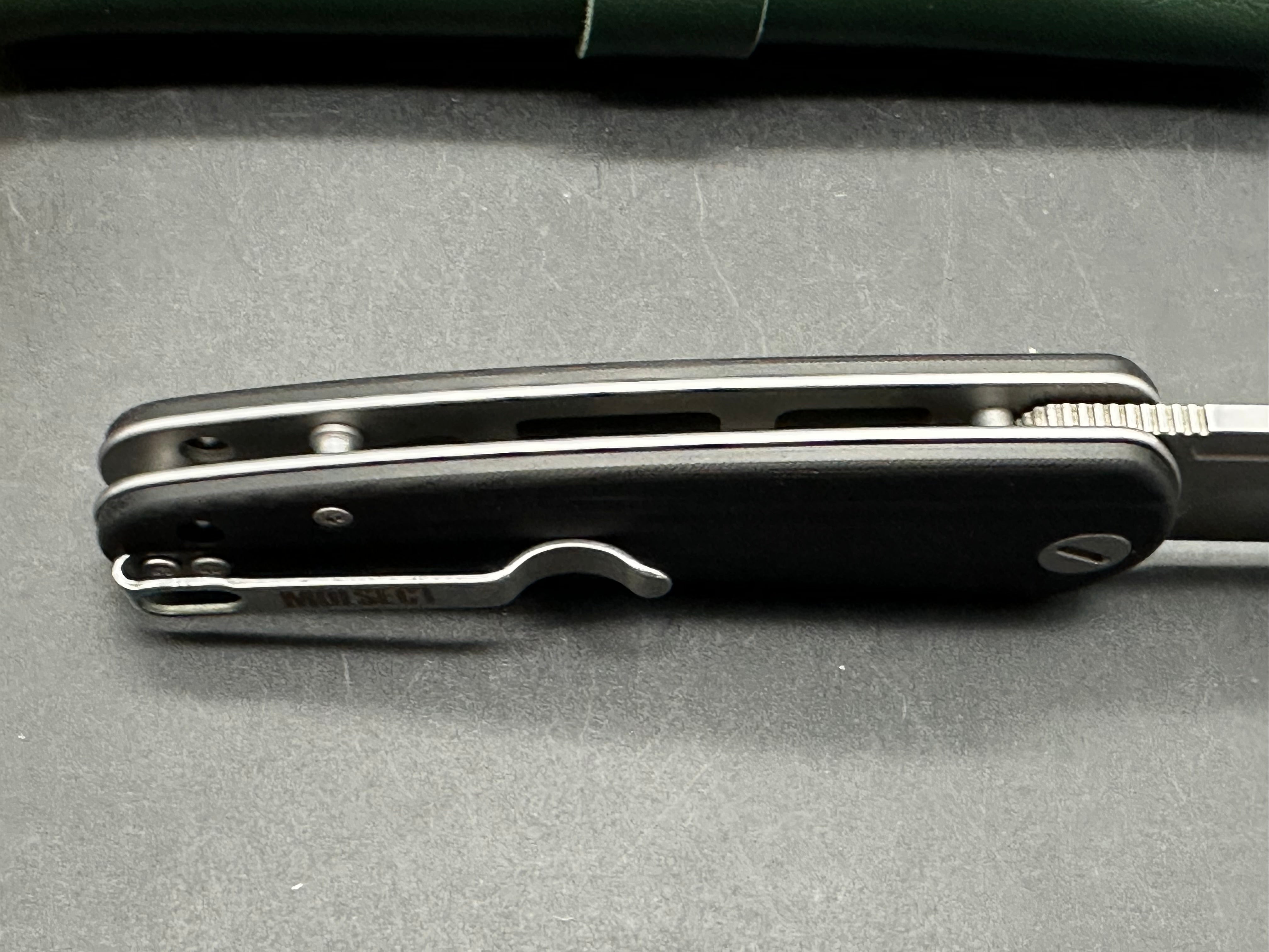 Molsect Orbit liner lock black G10 scales hollow grind 14C28N blade