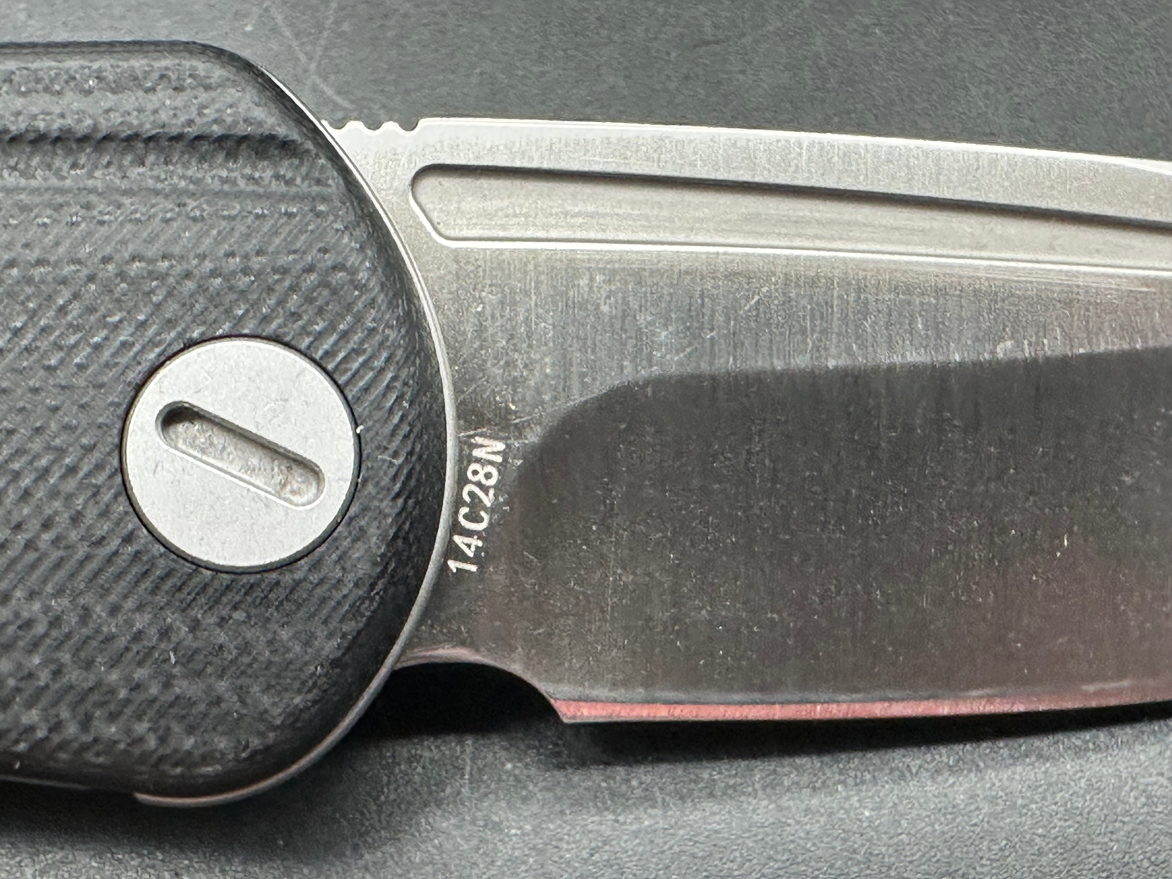 Molsect Orbit liner lock black G10 scales hollow grind 14C28N blade