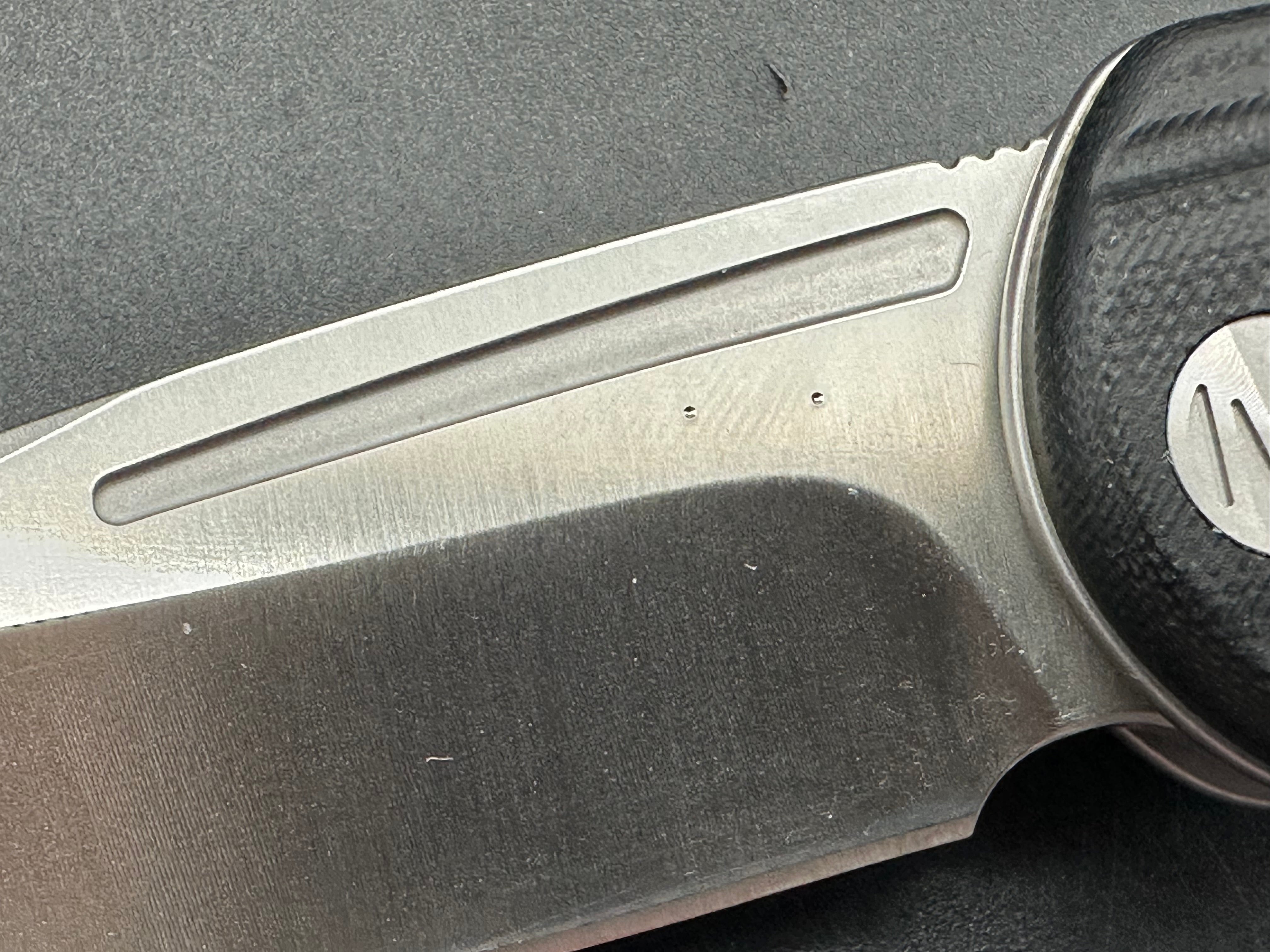 Molsect Orbit liner lock black G10 scales hollow grind 14C28N blade