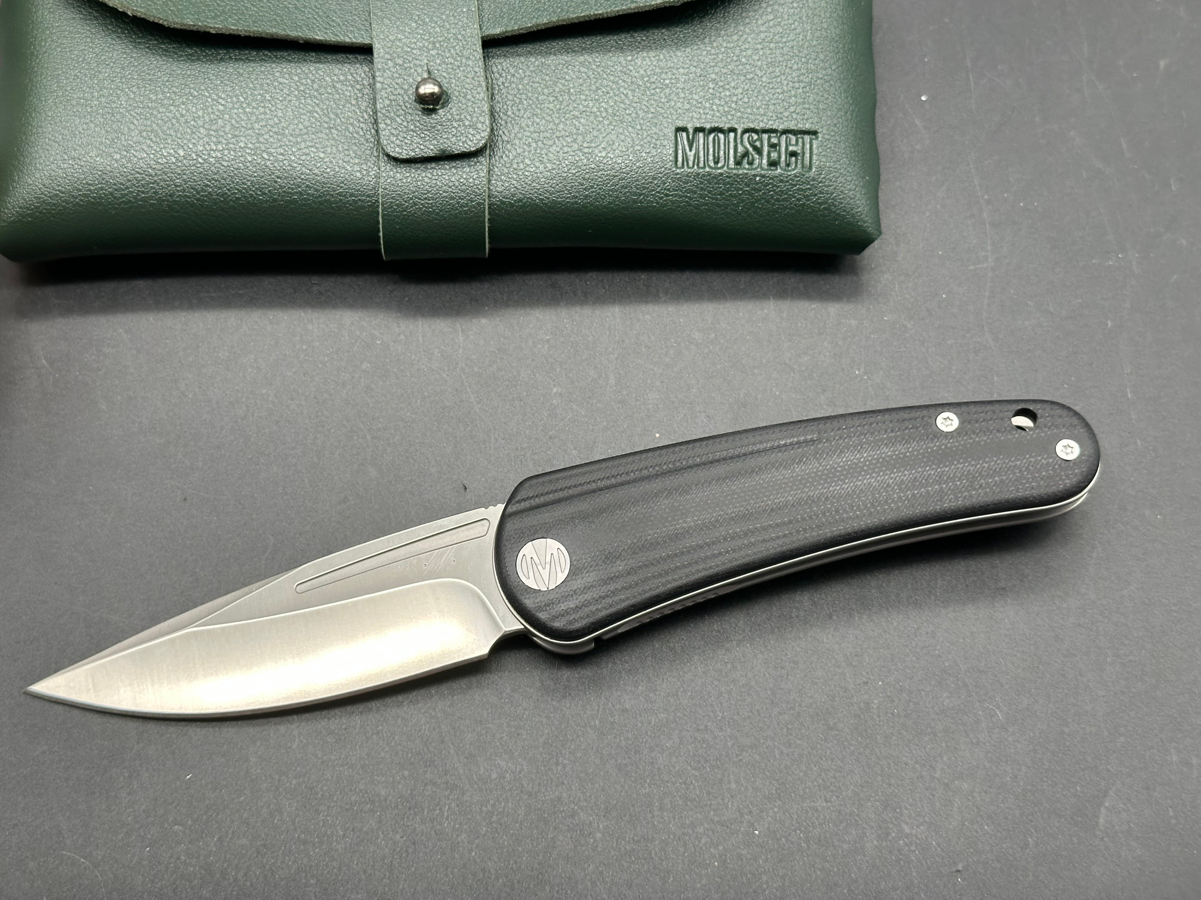 Molsect Orbit liner lock black G10 scales hollow grind 14C28N blade