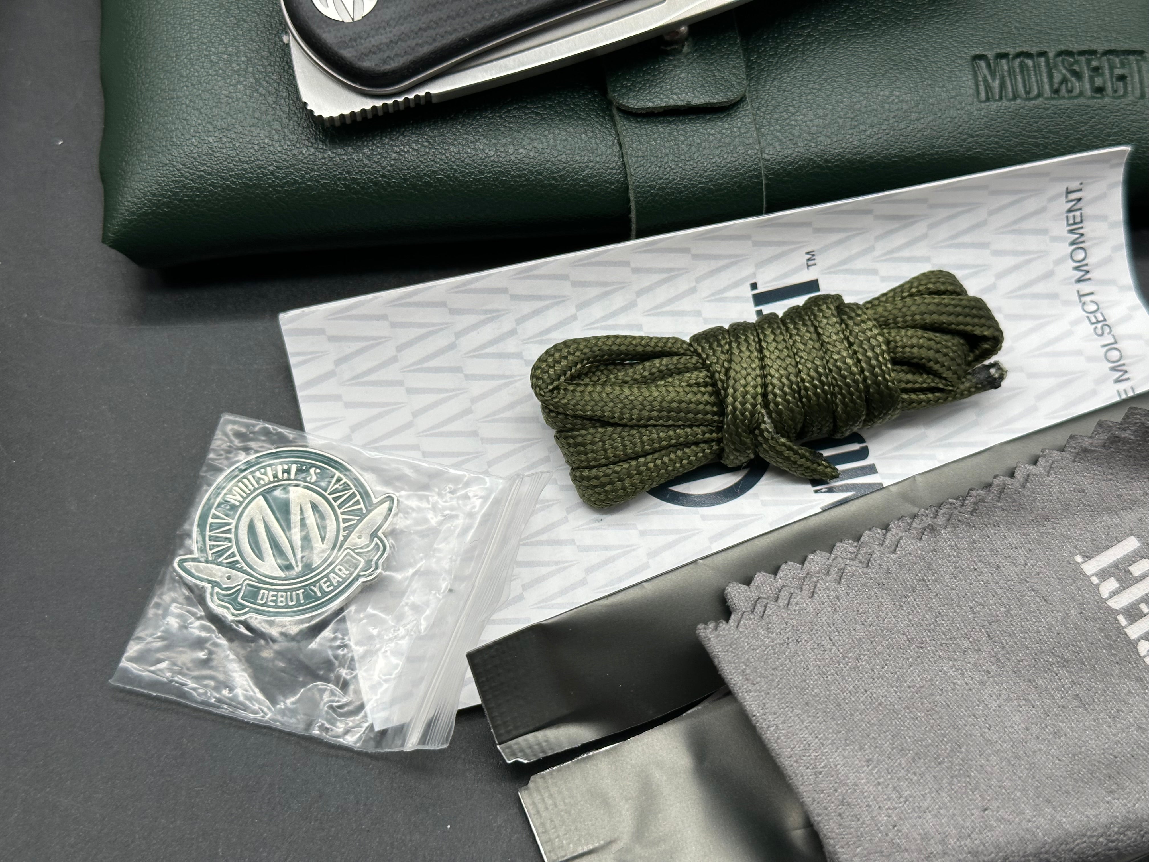 Molsect Orbit liner lock black G10 scales hollow grind 14C28N blade