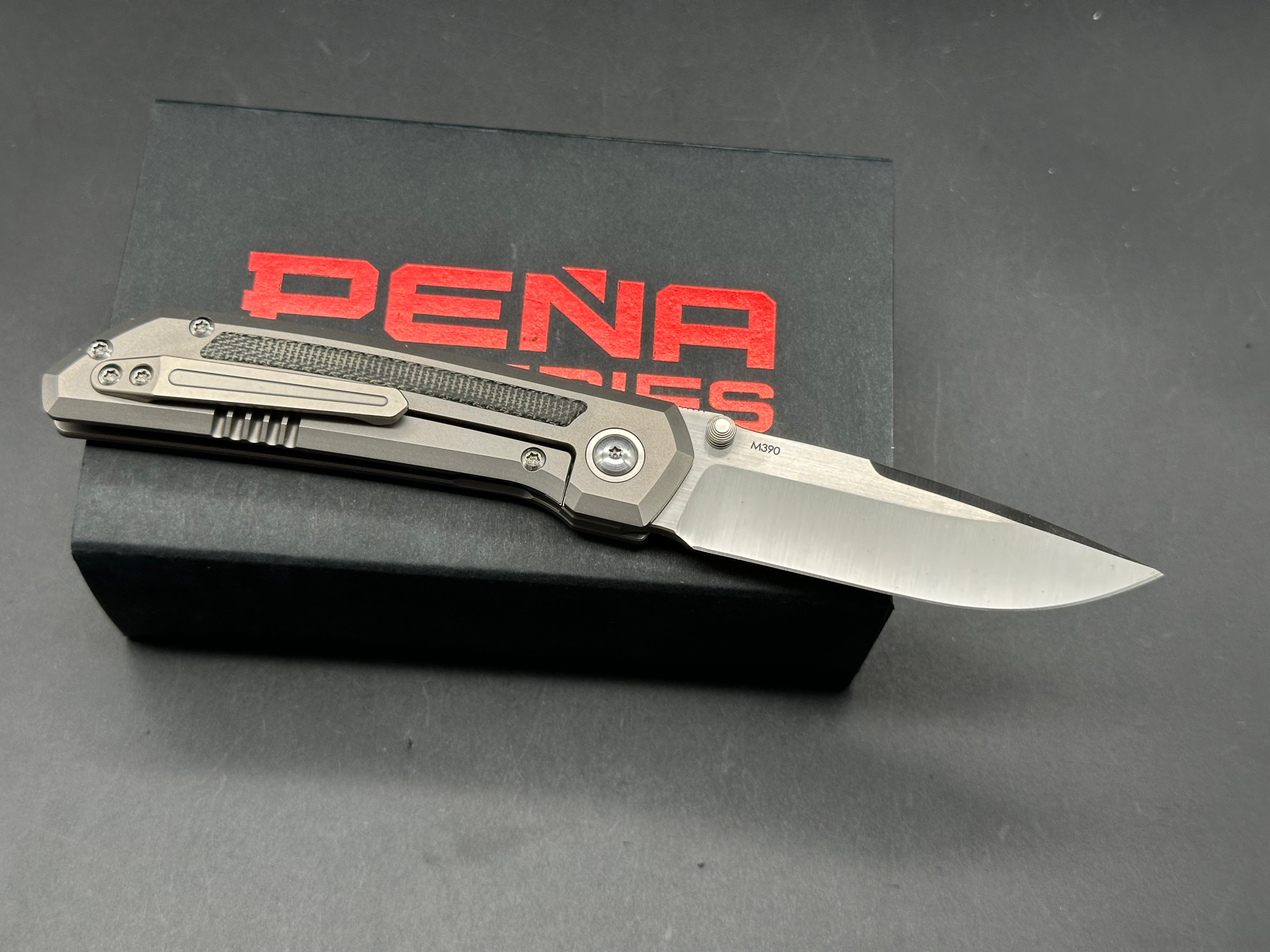 Pena X-Series Mula Drop Point, Belt Satin M390 Blade, Titanium Handles with Black Micarta Inlays
