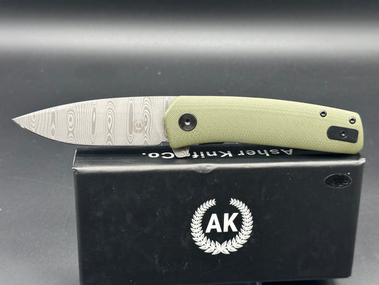 Asher Knives The Spiro flipper OD green G10 S35VN LNIB - blem Lasered ladder damascus