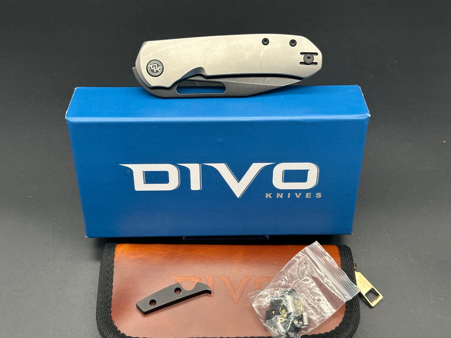 Divo knives Buzz reverse tux bead blasted titanium w/ black washed 20cv w/ zircuti back spacer and Skiff bearings