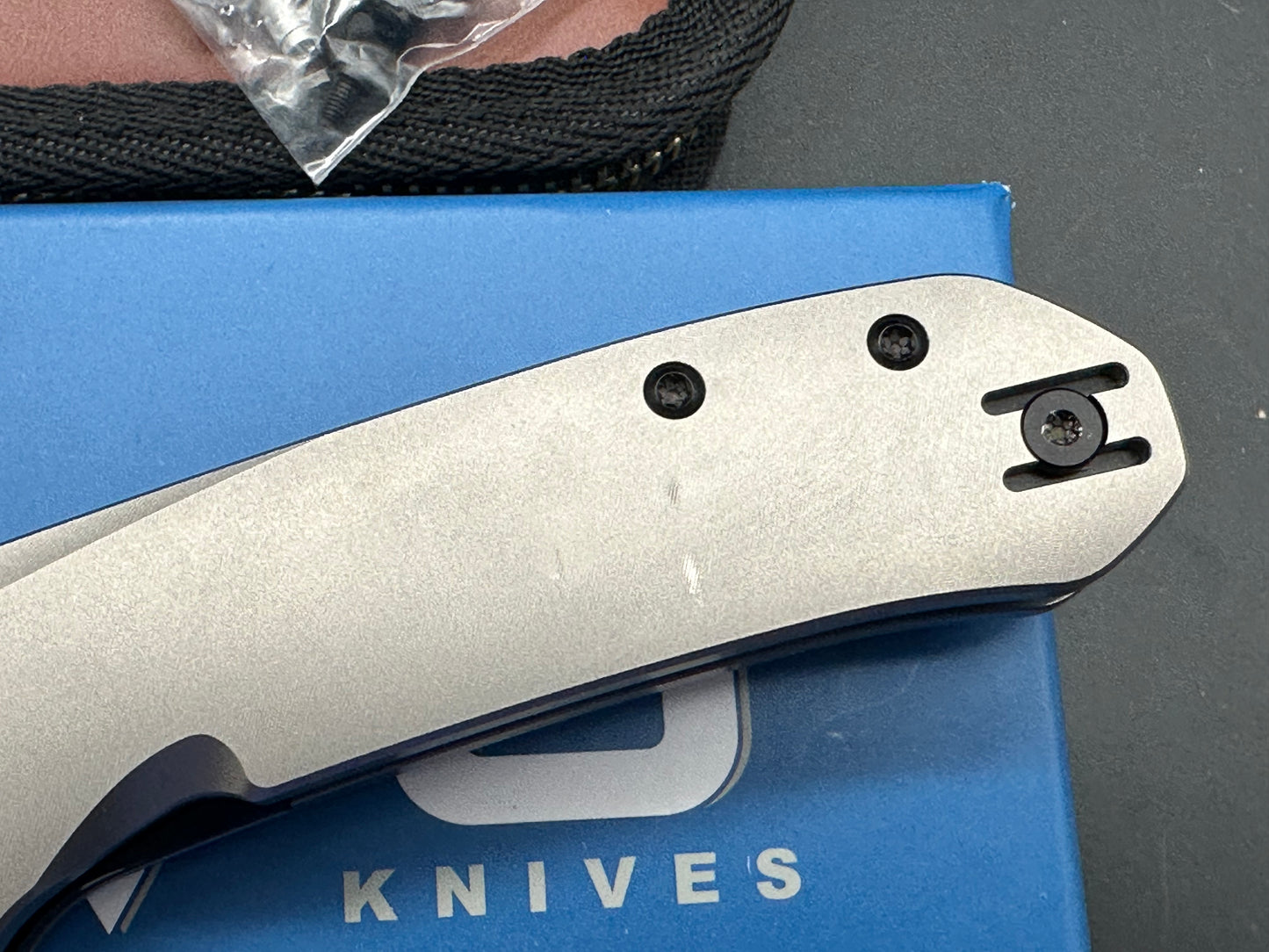 Divo knives Buzz reverse tux bead blasted titanium w/ black washed 20cv w/ zircuti back spacer and Skiff bearings