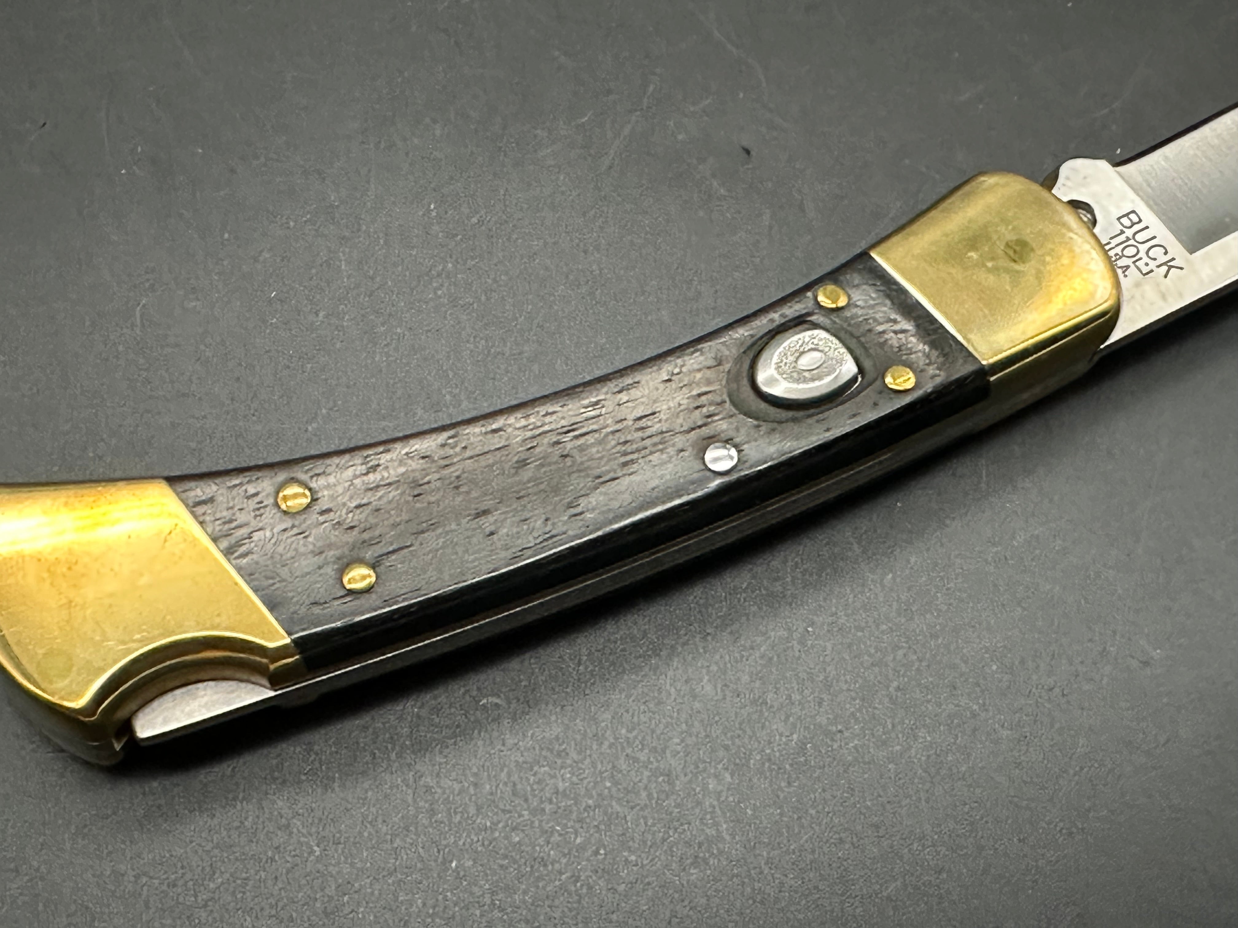 Buck 110 Automatic Ebony/Brass, 420HC Steel, w/Sheath