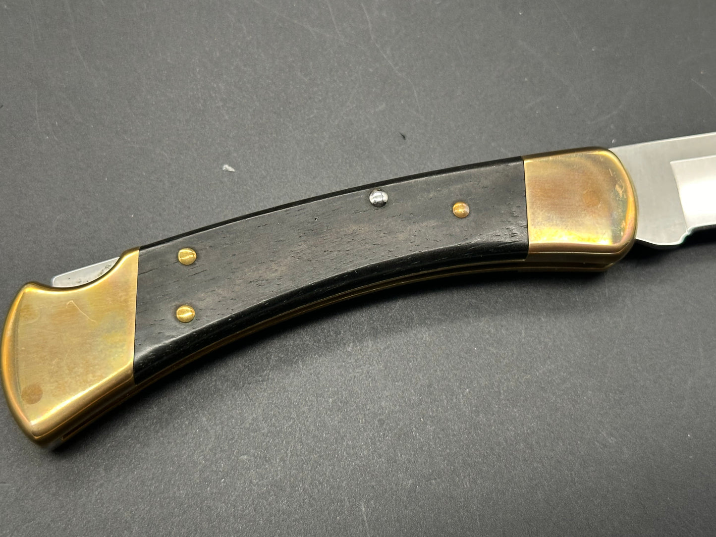 Buck 110 Automatic Ebony/Brass, 420HC Steel, w/Sheath