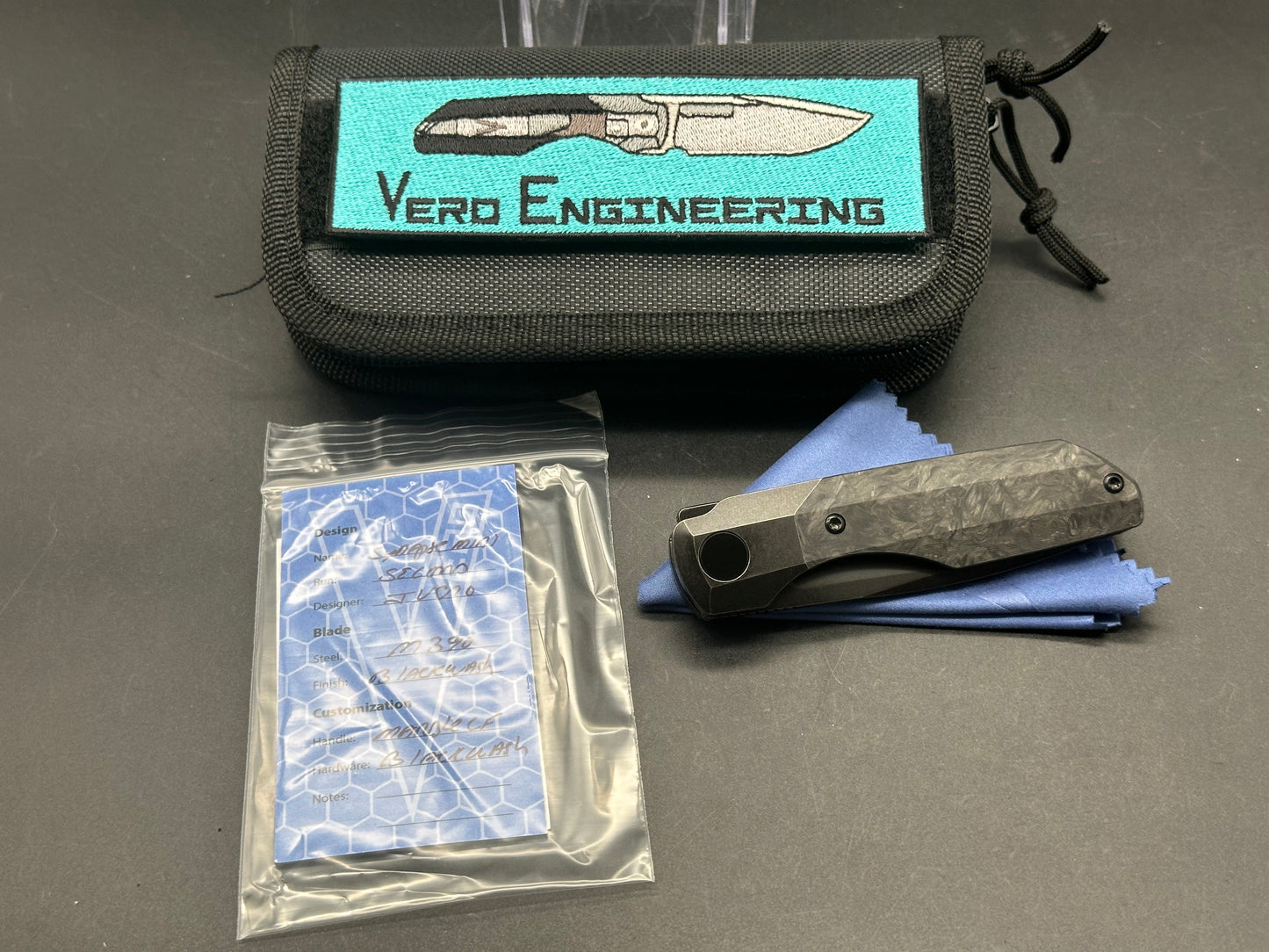 Vero Synapse Mini (2nd Run) - #1228, M390 Blade, Full Blackwash Ti with Marbled Carbon Fiber Scales