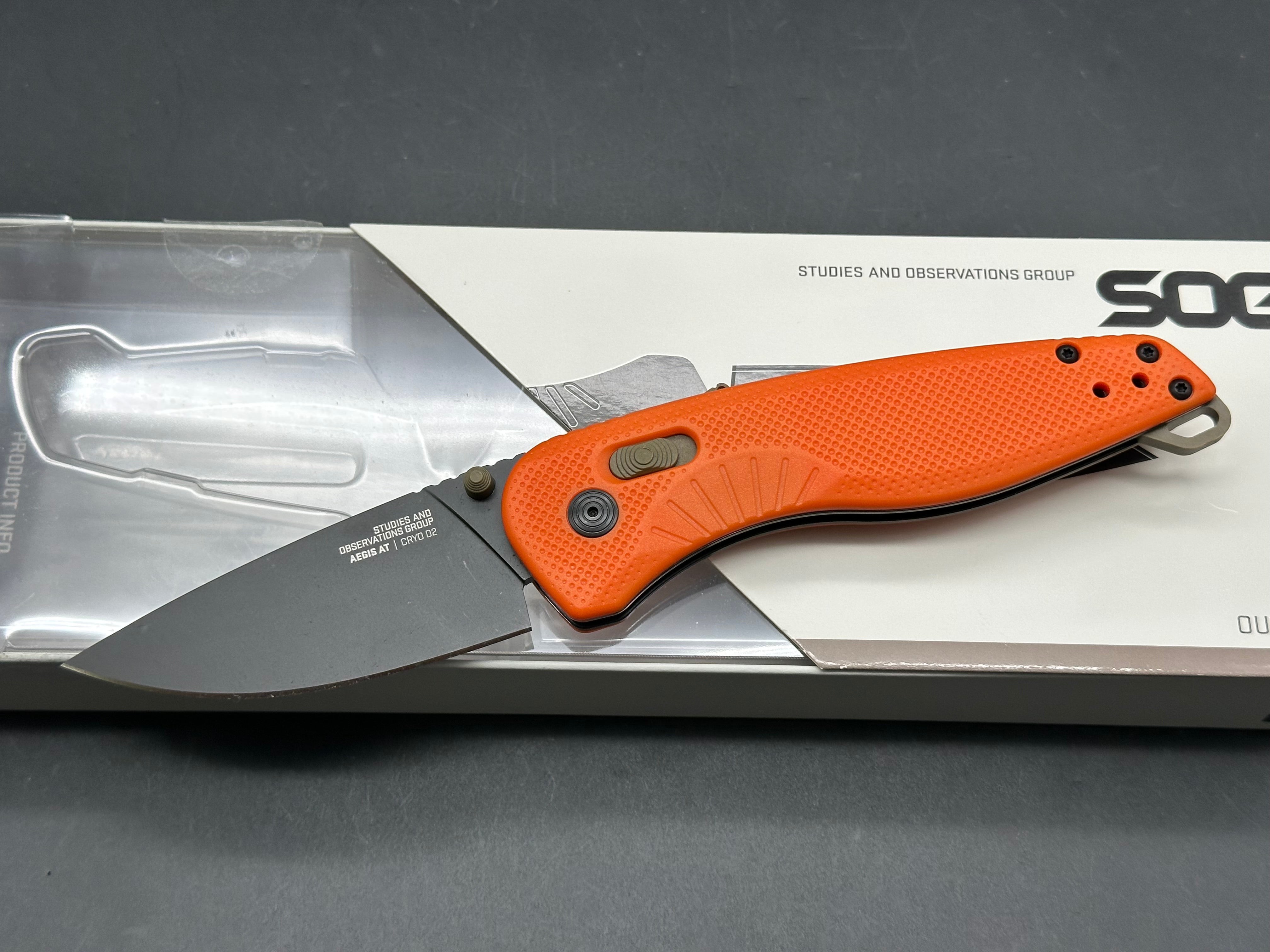 SOG Aegis AT Blaze and Tan Assisted Folding Knife 3.13" D2 Black Plain Blade, Orange GRN Handles