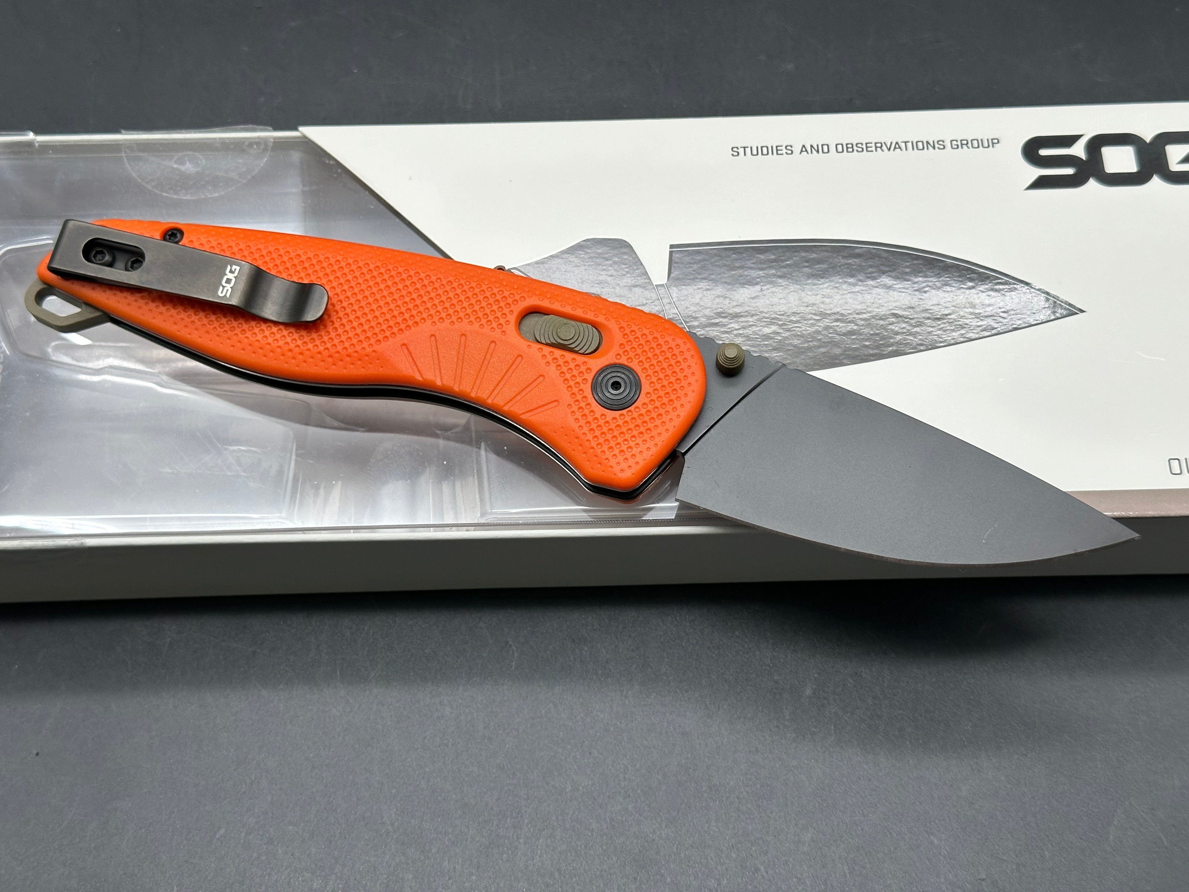 SOG Aegis AT Blaze and Tan Assisted Folding Knife 3.13" D2 Black Plain Blade, Orange GRN Handles