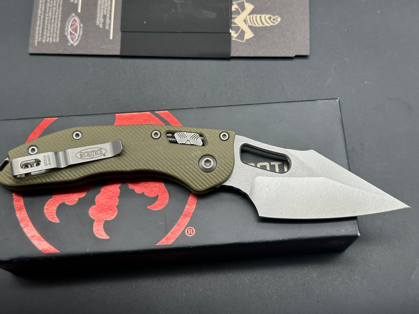 Microtech Stitch RAM-LOK 3.75” M390MK Stonewash Blade with a Fluted G10 handle in OD Green