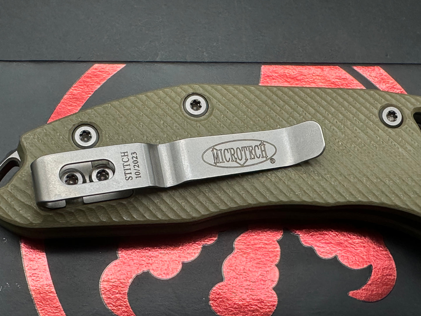 Microtech Stitch RAM-LOK 3.75” M390MK Stonewash Blade with a Fluted G10 handle in OD Green