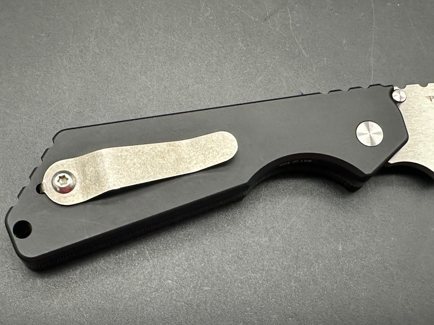 Protech Strider SNG black micarta/aluminum scales mirror polished compound grind 154CM blade / mother of pearl button