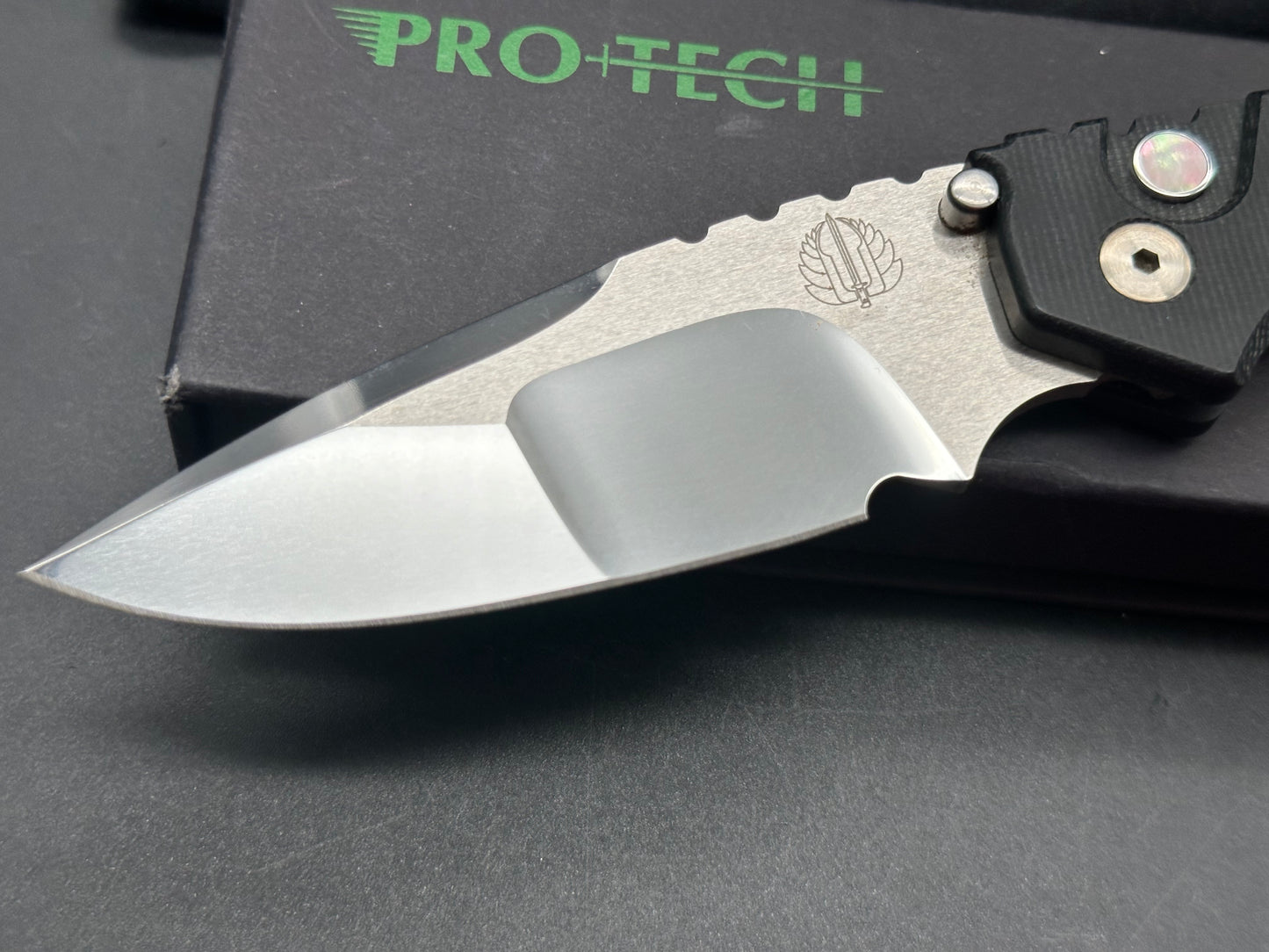 Protech Strider SNG black micarta/aluminum scales mirror polished compound grind 154CM blade / mother of pearl button