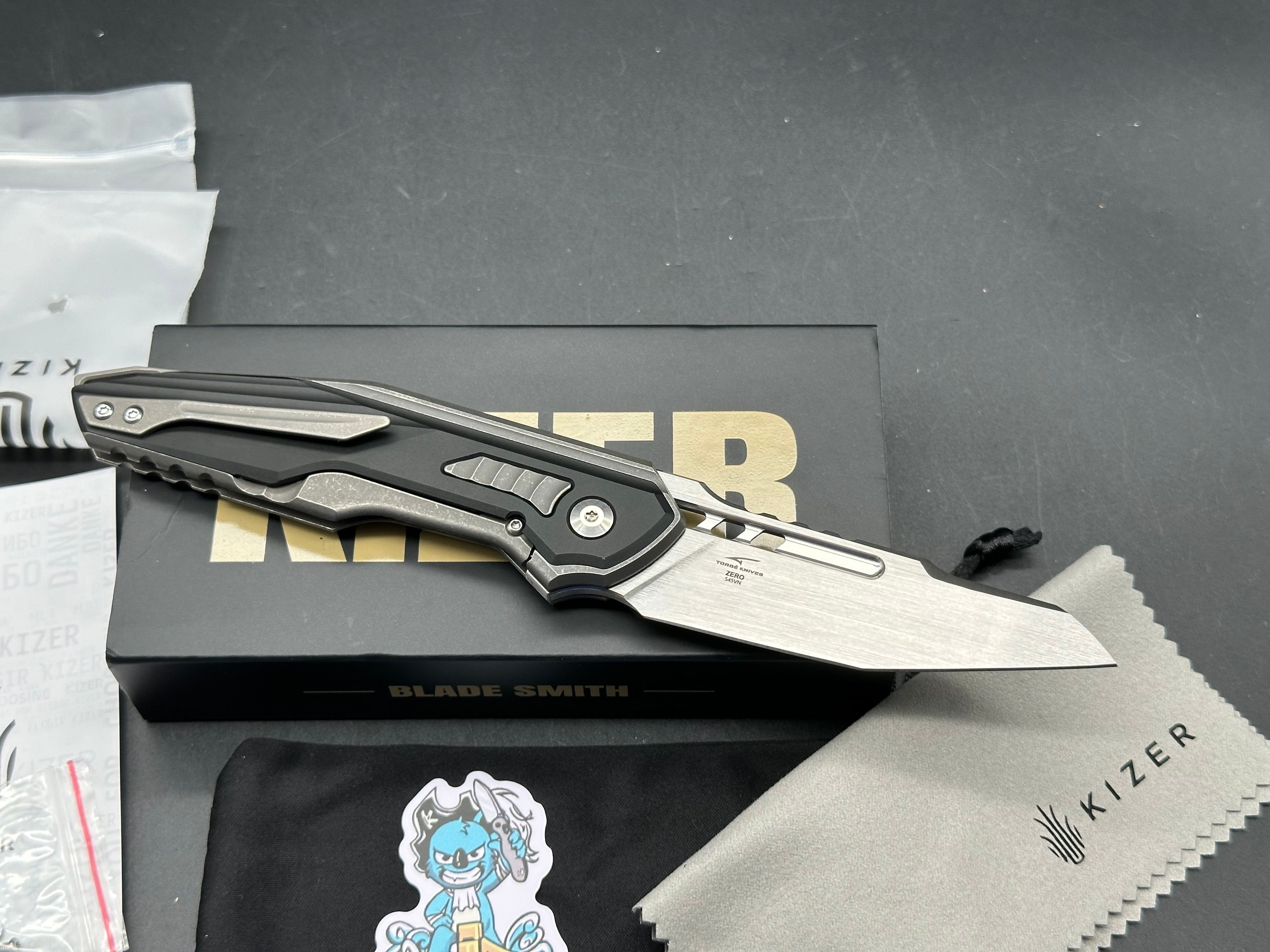 KIZER ZERO BLACK/GRAY TITANIUM/ALUMINUM HANDLE S45VN REVERSE TANTO PLAIN EDGE