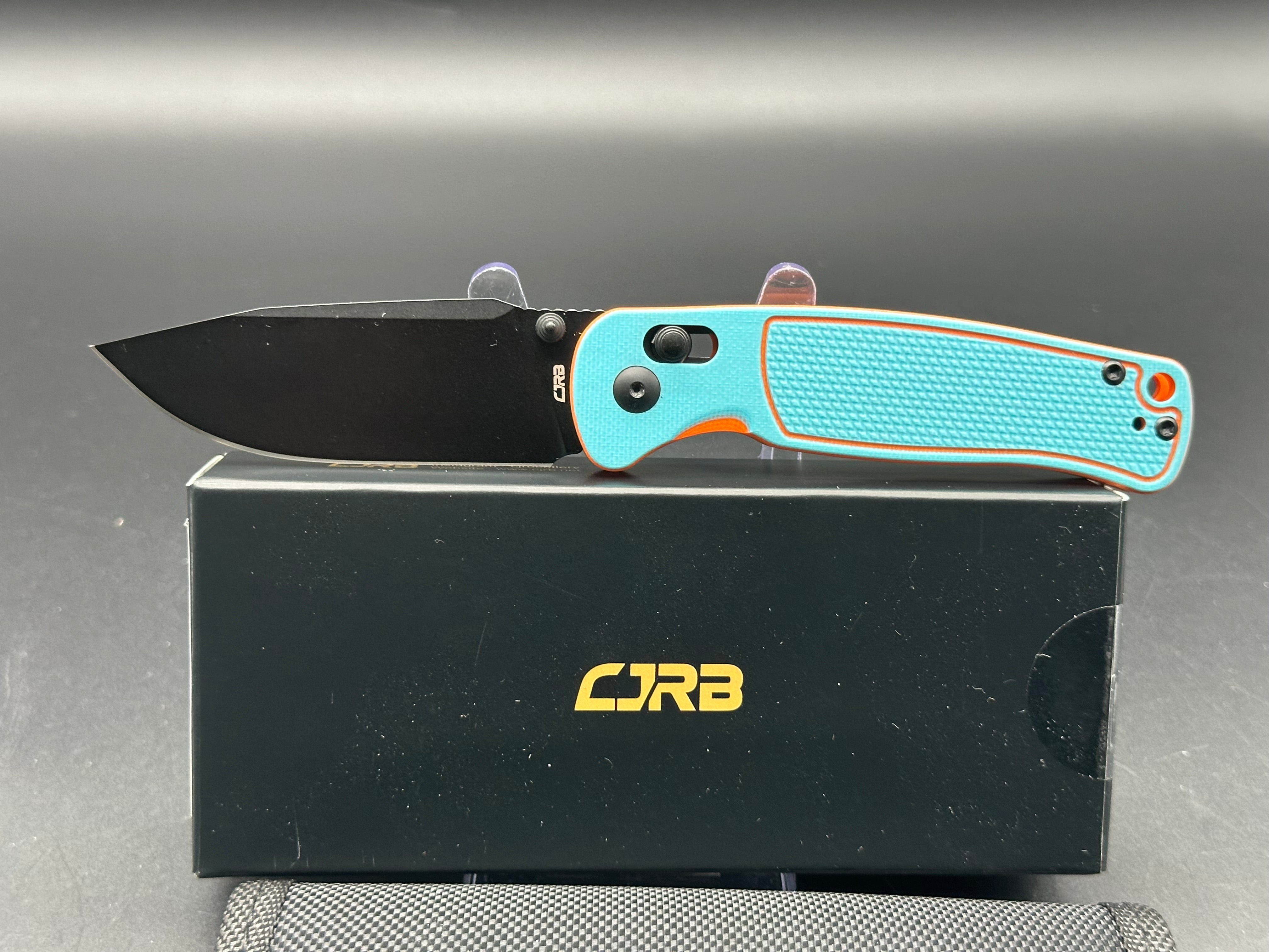 CJRB SHALE FOLDING KNIFE BLUE/ORANGE G10 BLACK PVD AR-RMP9 BLADE