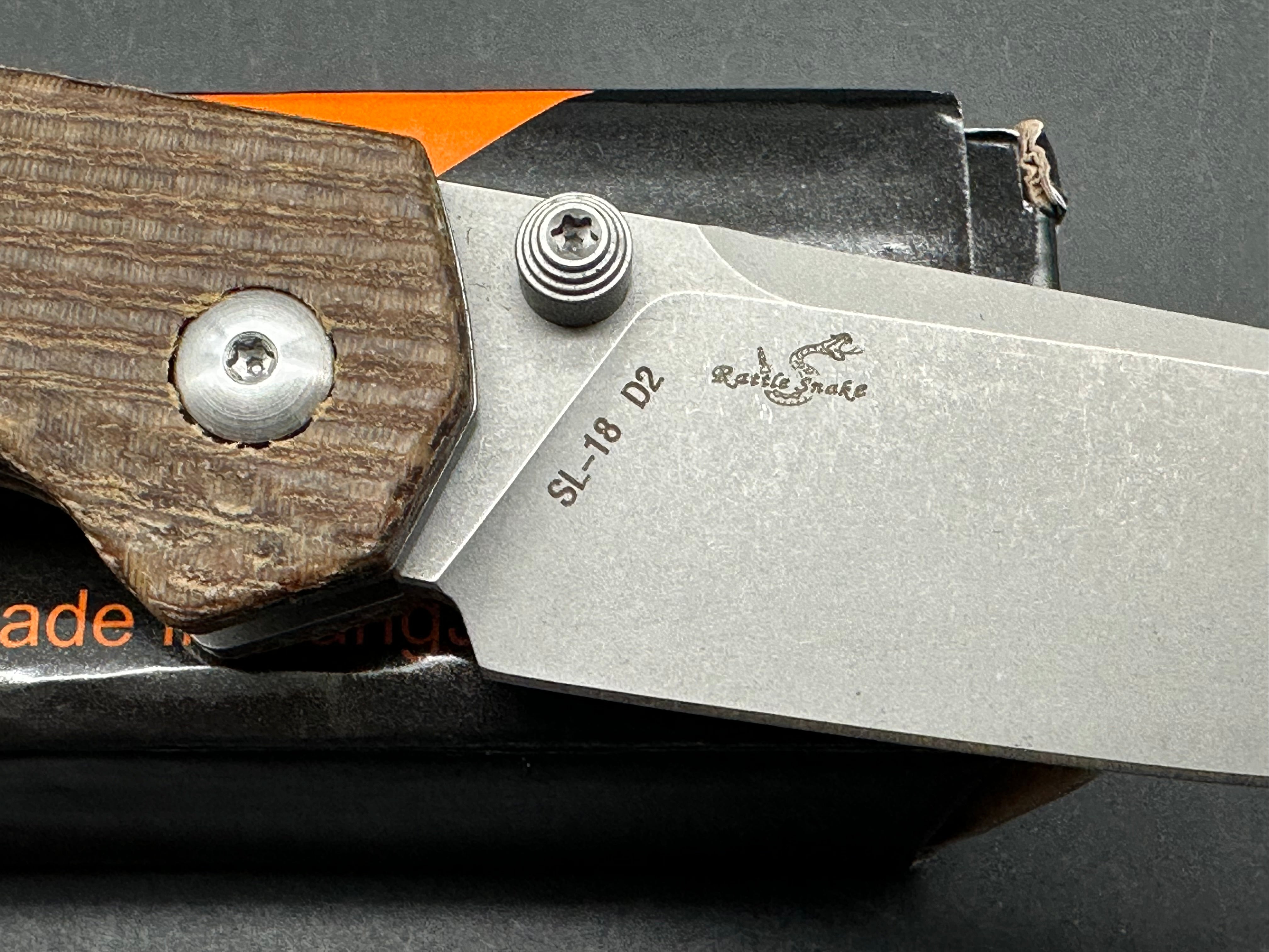 Sixleaf SL-18 Rattlesnake design, button lock, micarta scales, D2 blade