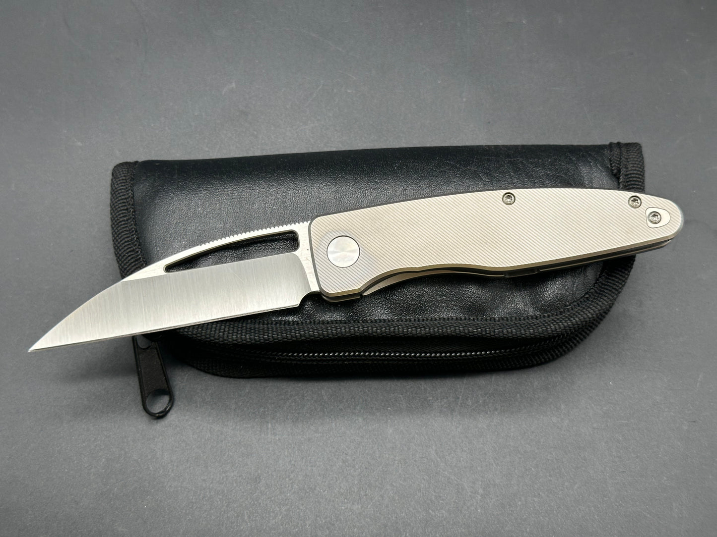 PKW Wharnetac CPM20cv hollow grind titanium handle