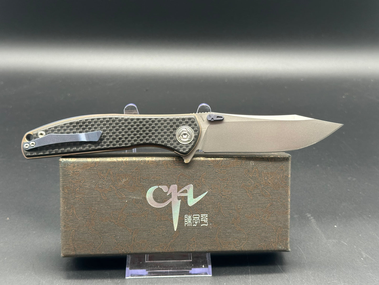 CH Knives CH3516 Bronze TI Frame, CF scales. Blue thumb studs, back spacer and clip