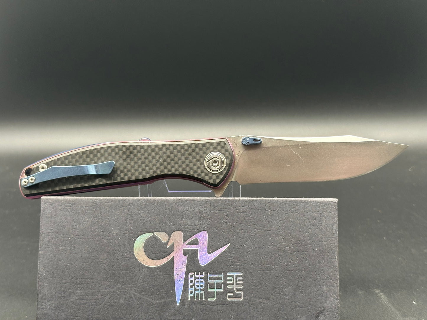 CH Knives "CH3516-1". S35vn, Purple TI Frame with CF Scales