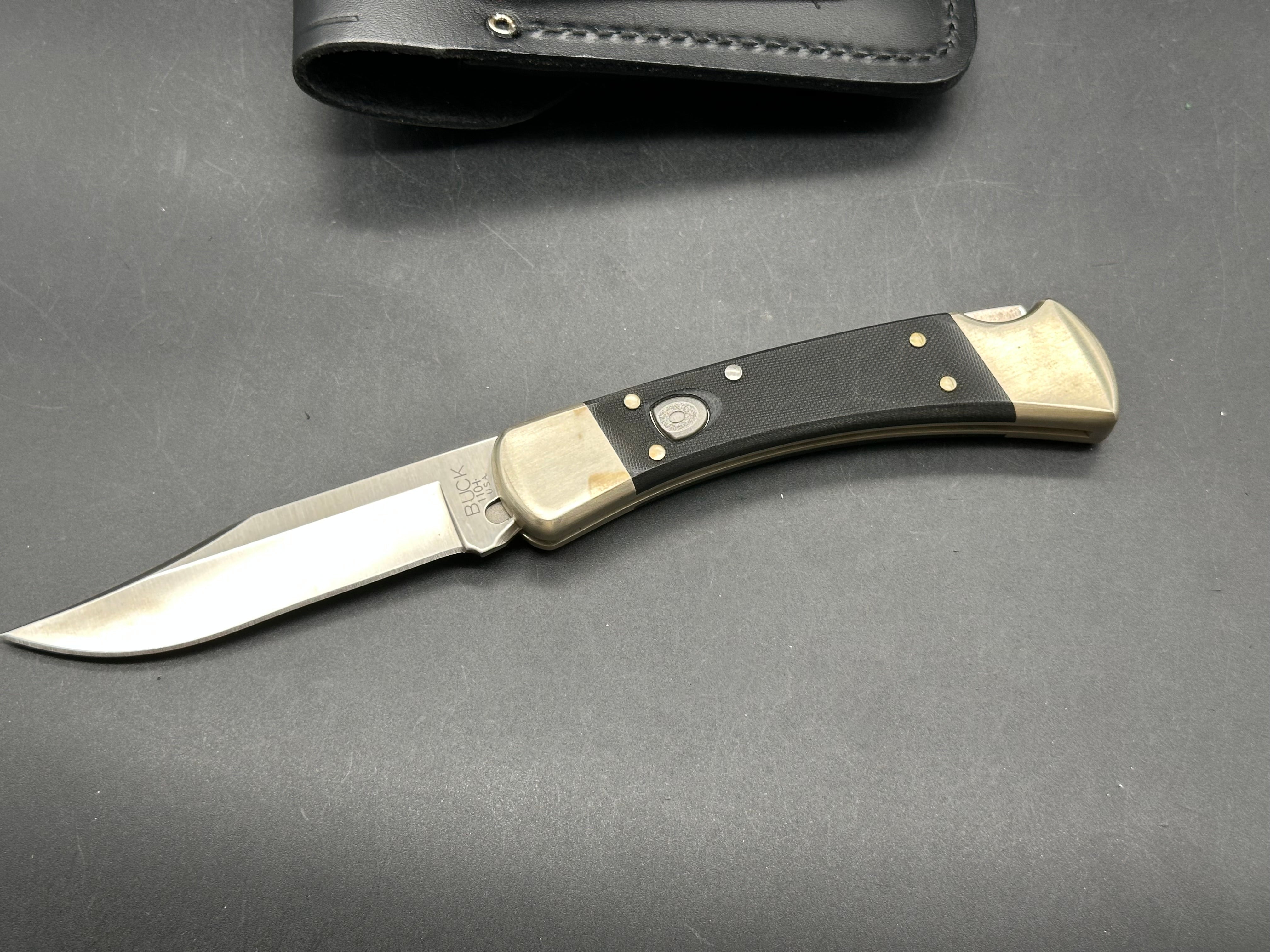 Buck 110 Auto, black G-10 scales, nickel bolsters, with scabbard