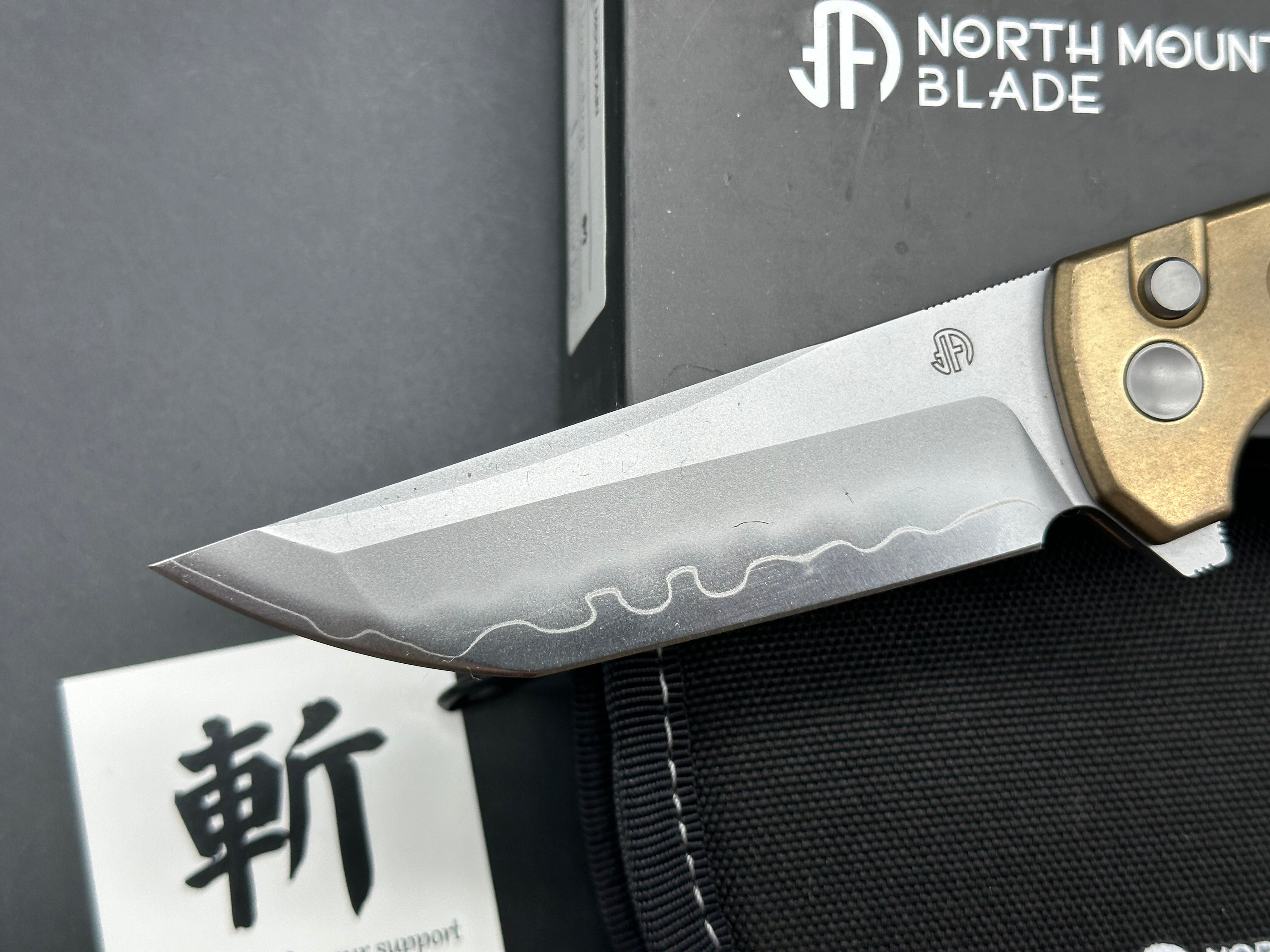 North Mountain Blade Chop 2 Button Lock Flipper Knife 3.5" SLD Hamon Drop Point Blade, Aluminum Bronze Handles with Speed Holes