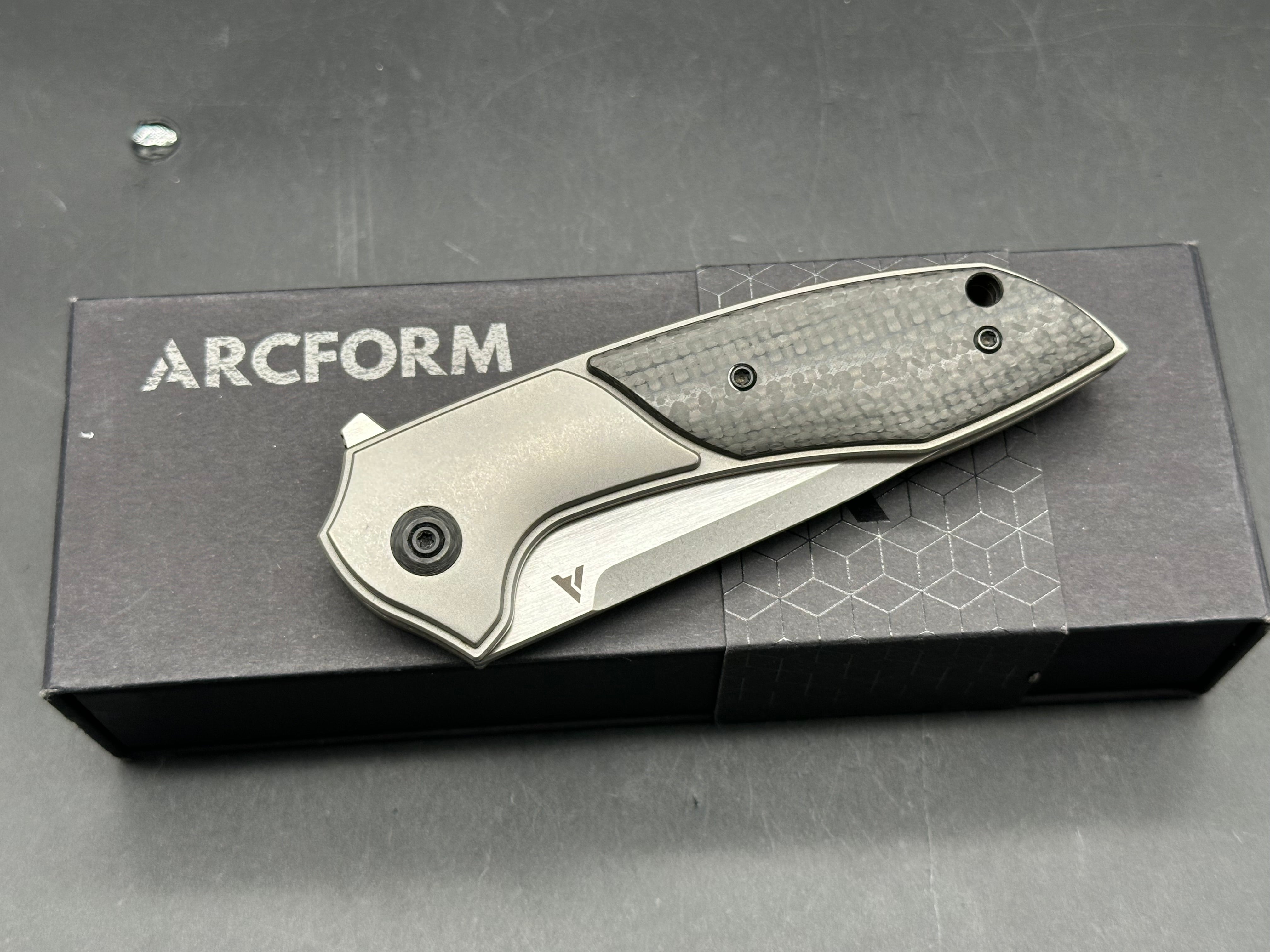 Arcform Catalyst: Geoff Blauvelt design. 3.5 inch  CPM-S35VN blade. Frame lock. Titanium and carbon fiber handle