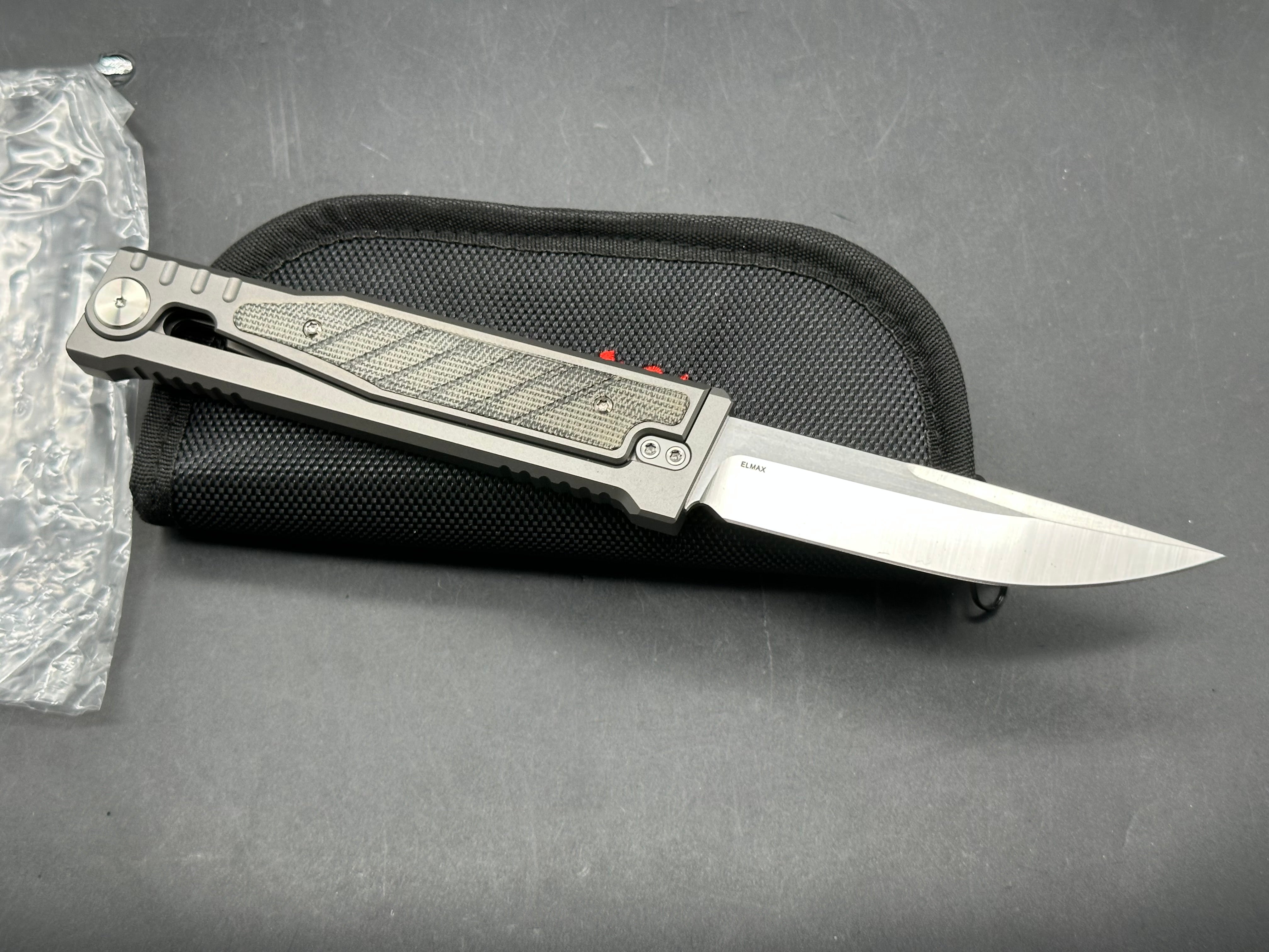 Reate Exo 3.75 inch Elmax gravity drop blade Titanium frame with green micarta inserts