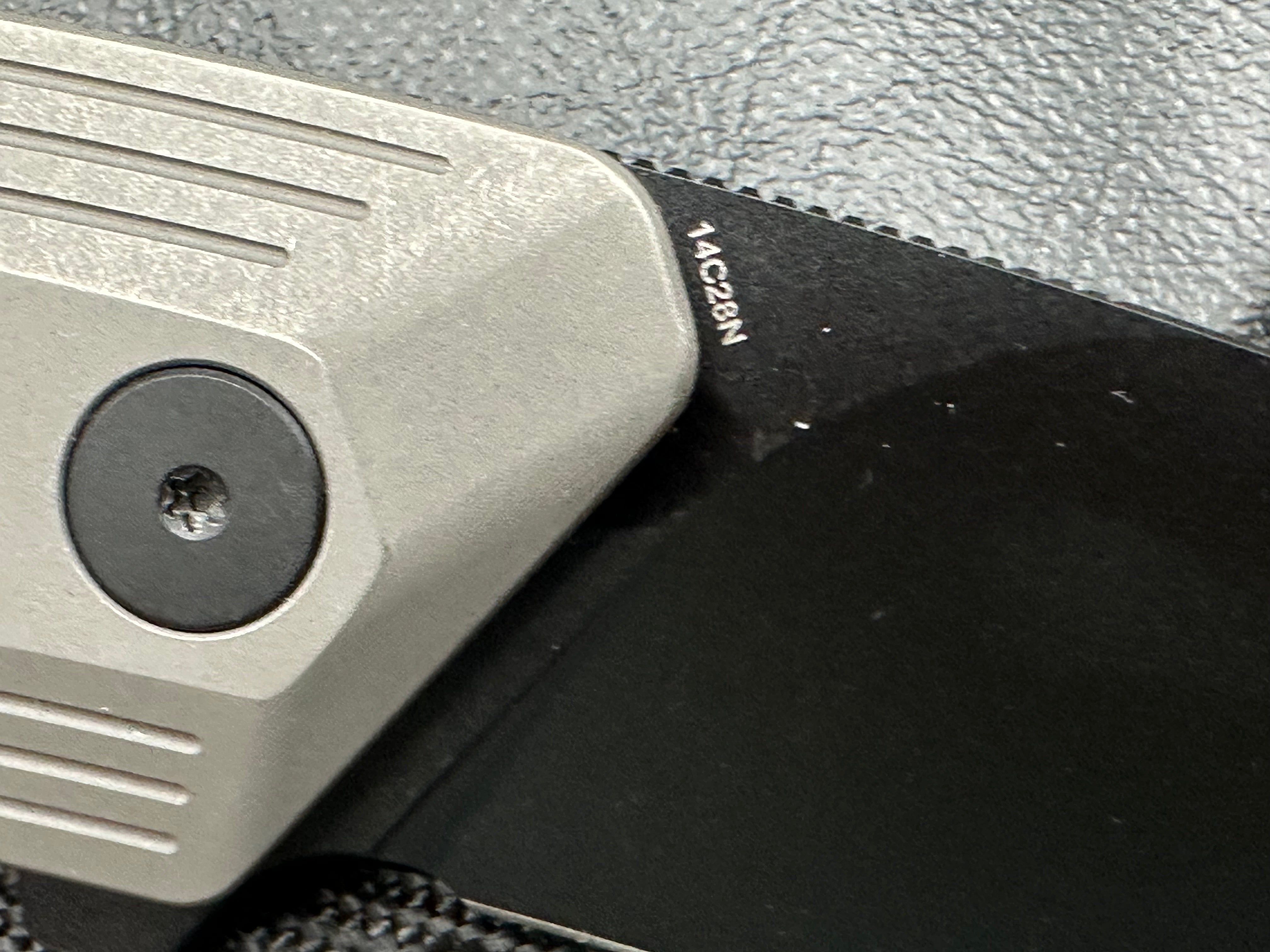 Damned Designs Invictus 3.5 inch 14C28N DLC coated blade. Titanium frame