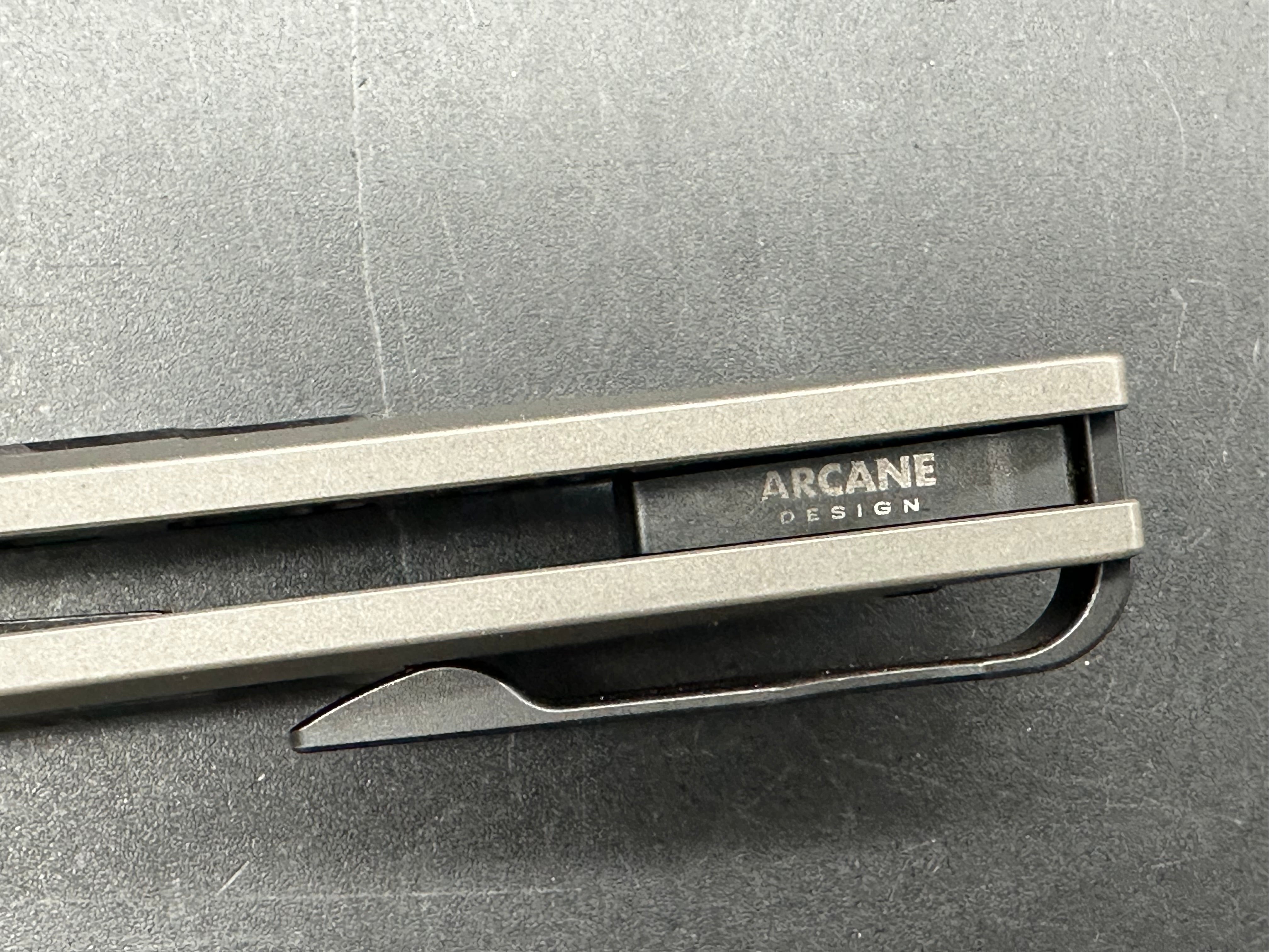Arcane Designs Preytheon 3.125 inch acid etched, tumbled CPM-20CV blade. Milled and tumbled titanium frame