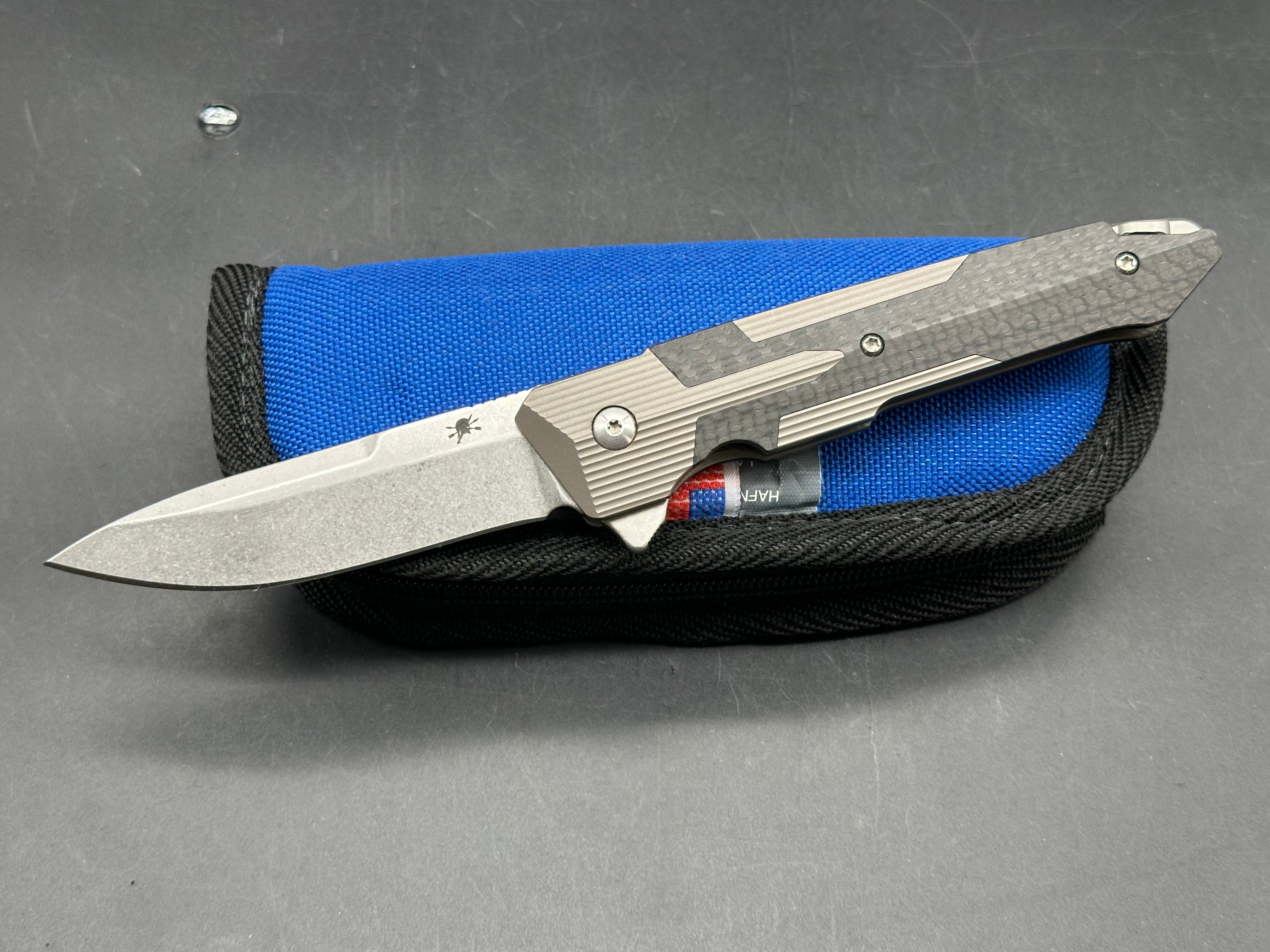 Spartan Blades Kranos 3.375 inch CPM-S35VN blade. Machined titanium handle with Spartan inspired carbon fiber inlays