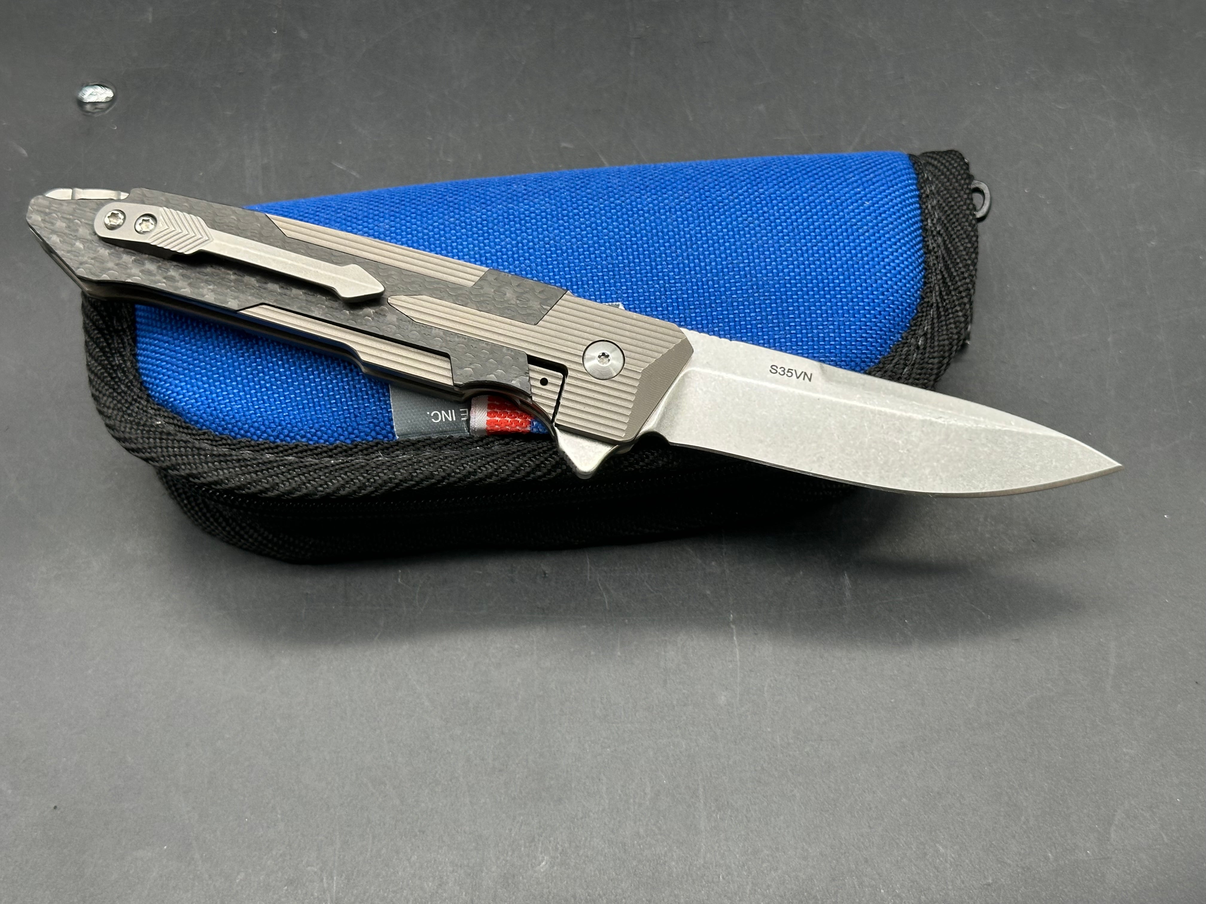 Spartan Blades Kranos 3.375 inch CPM-S35VN blade. Machined titanium handle with Spartan inspired carbon fiber inlays