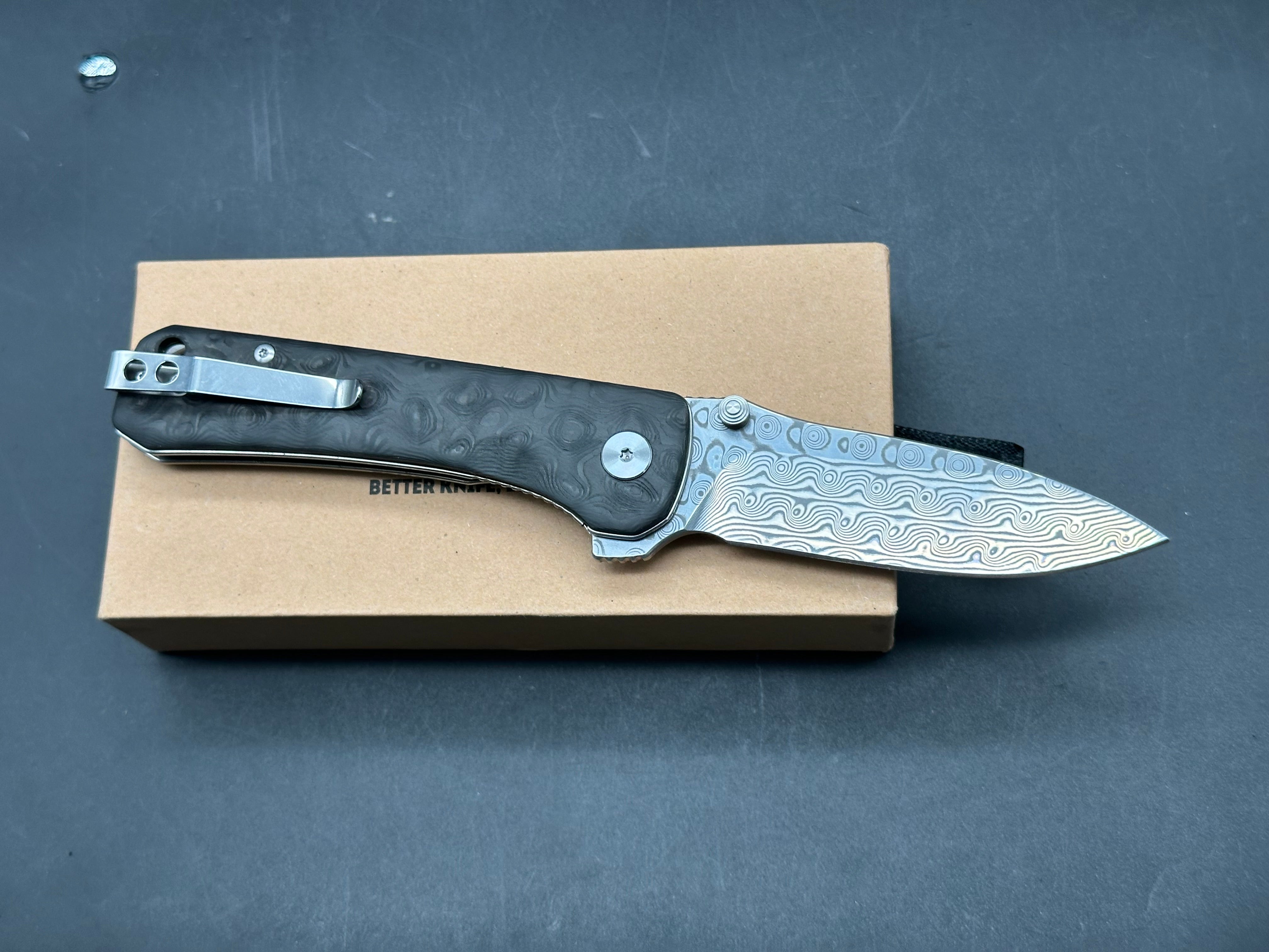 QSP Hawk 3.25 drop point, flat grind Damascus blade. Ceramic ball bearings. Marbled carbon fiber scales