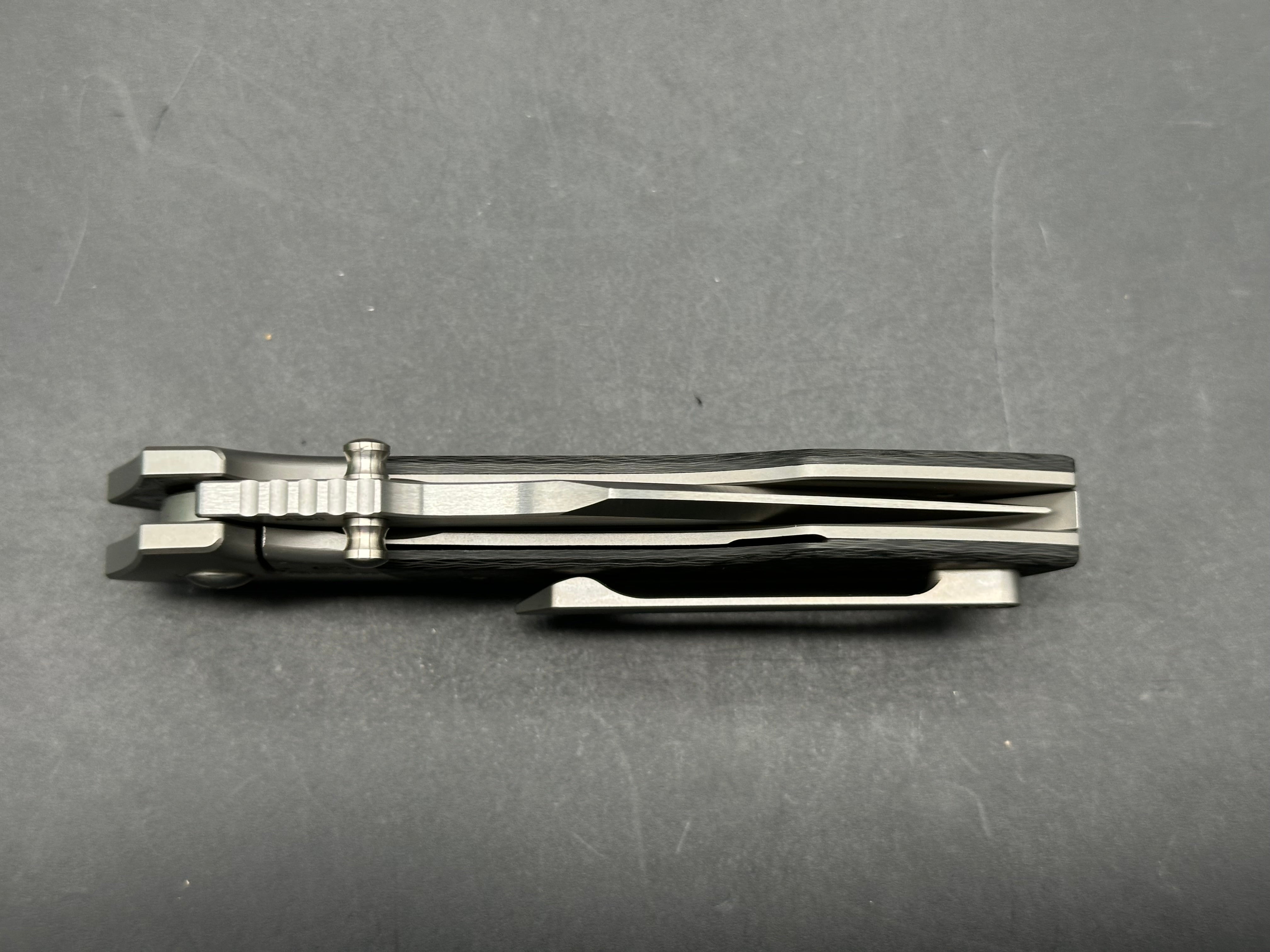 Burchtree Designs Secant Michael Burch design. 3.125 inch satin Bohler M390 blade. Titanium and carbon fiber frame