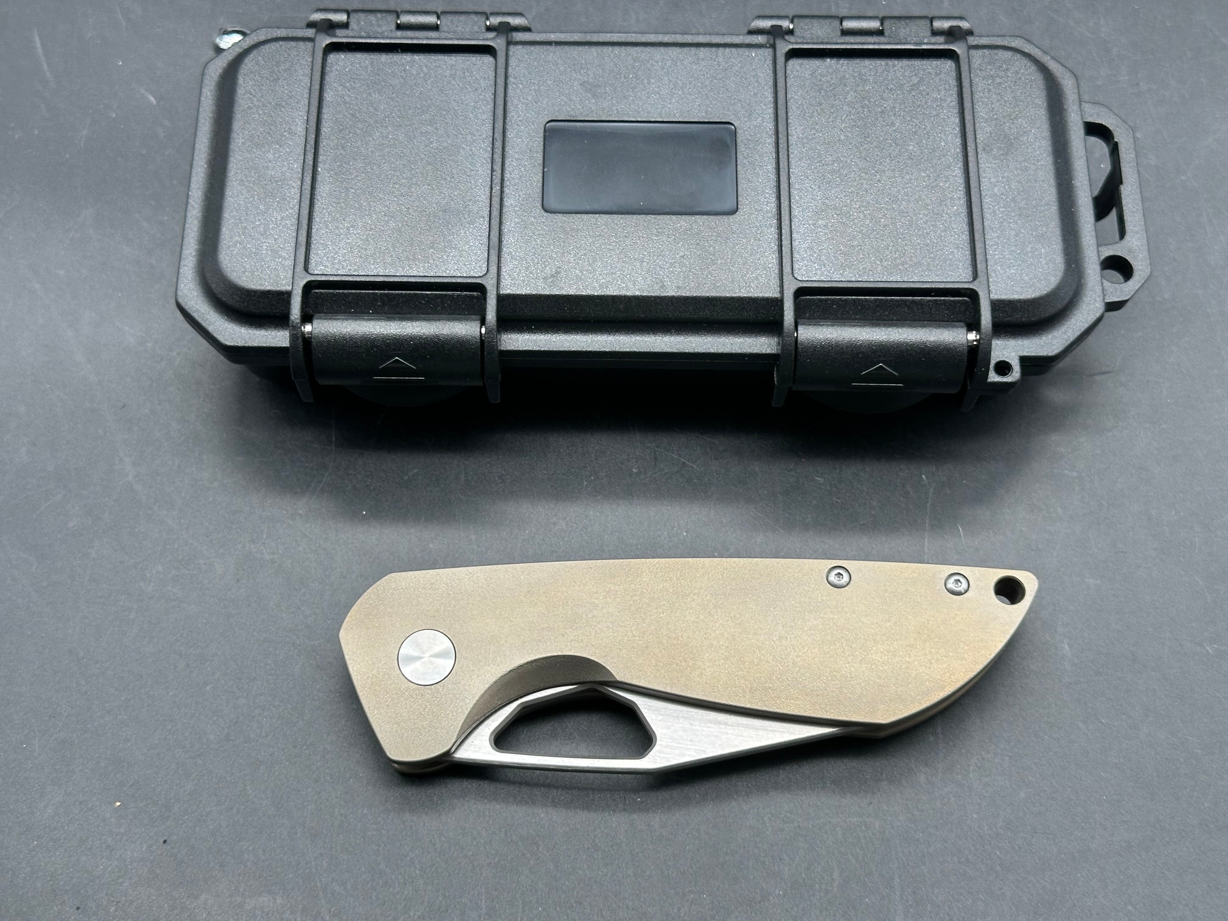 Tuyaknife Voodoo  3.25 inch satin finish Wharncliffe CPM-S90V blade. Orange peel titanium handle