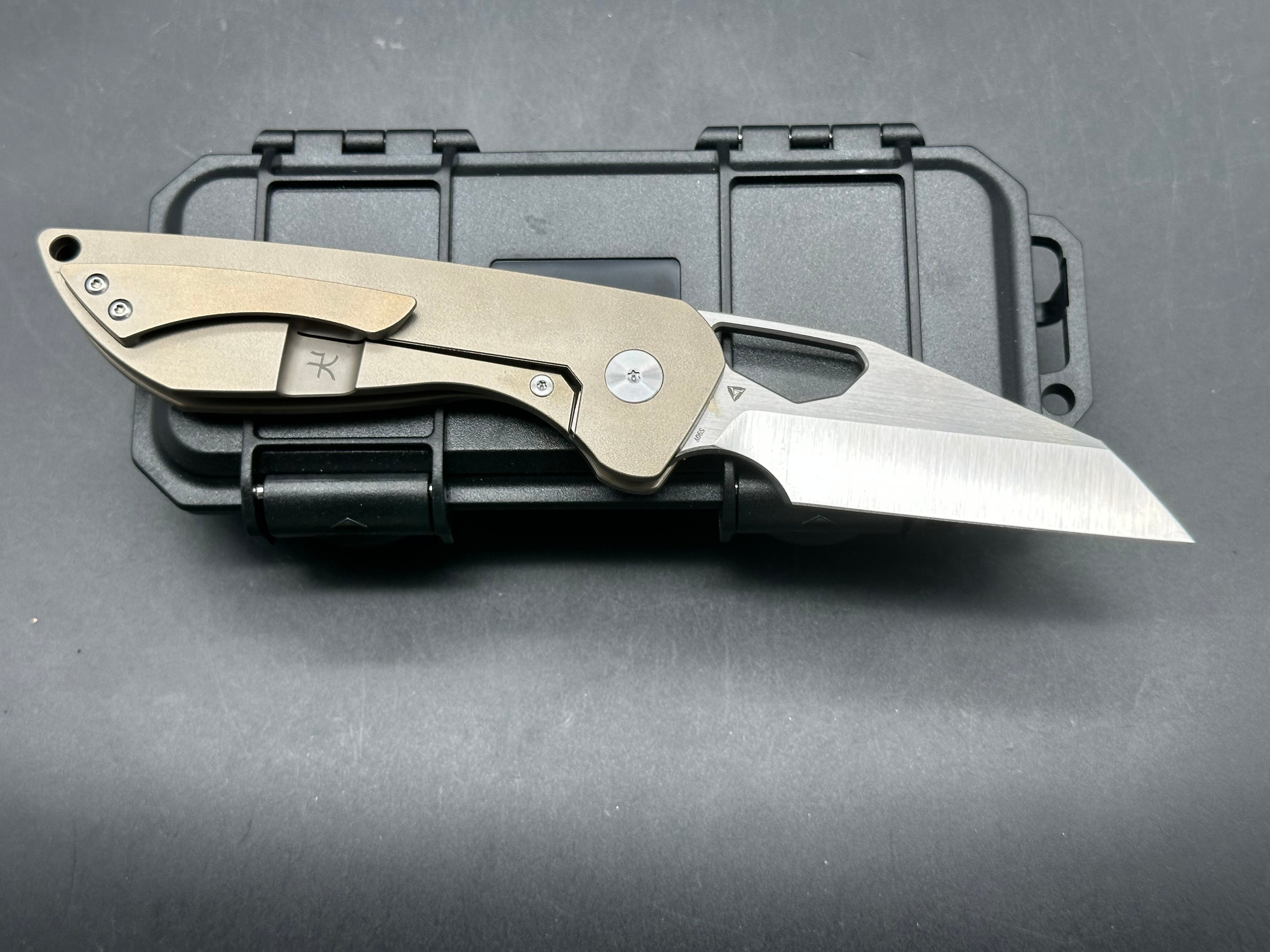 Tuyaknife Voodoo  3.25 inch satin finish Wharncliffe CPM-S90V blade. Orange peel titanium handle