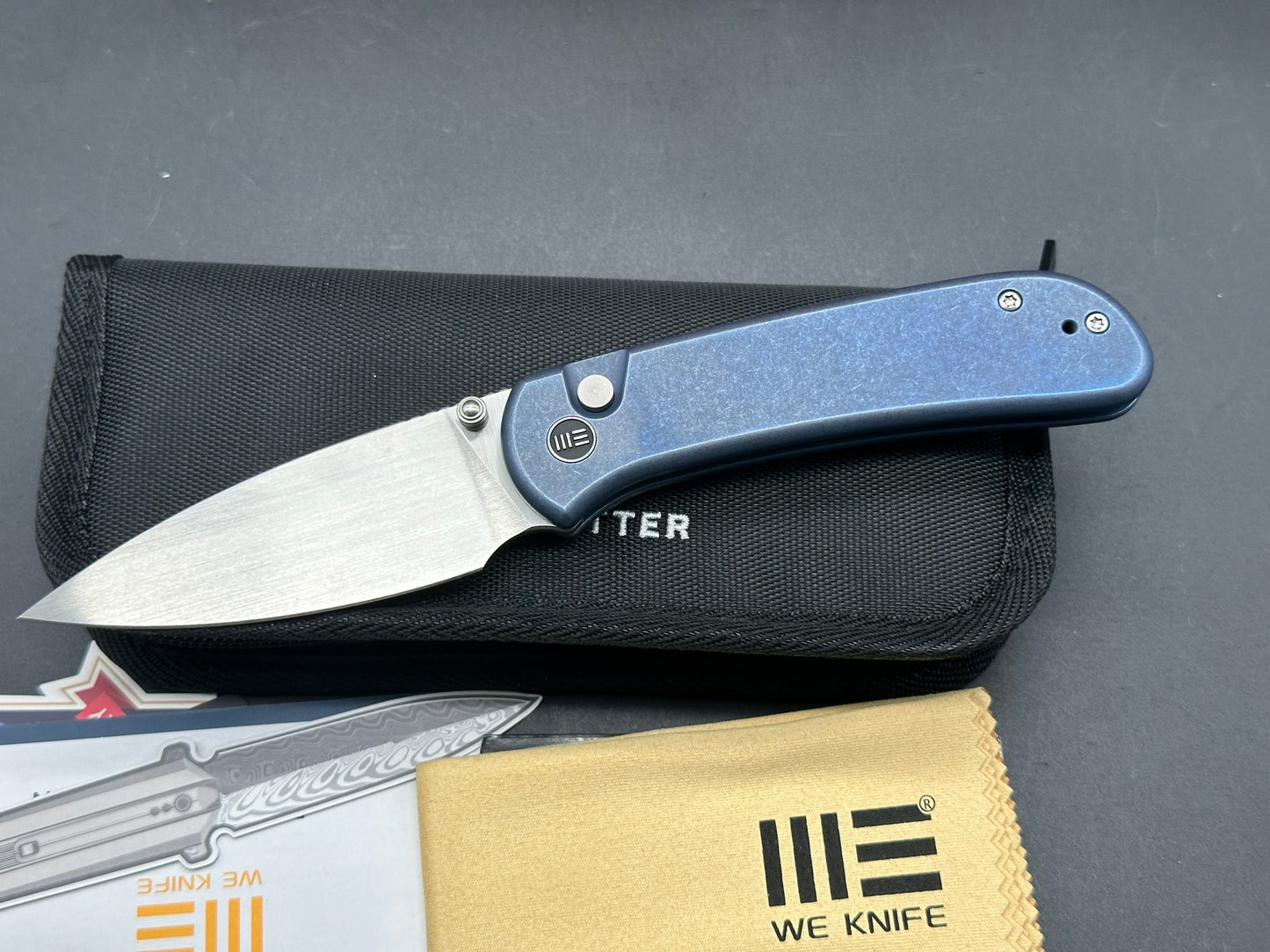 WE Qubit, 3.2" CPM 20CV Satin Drop Point Blade with Blue Stonewash Titanium handle